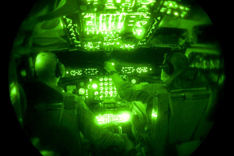 (Left) Capt. Christopher Bruck 384th Air Refueling Squadron pilot and First Lieutenant Joseph Schmerber, 384th ARS pilot, change the altitude on the cockpit dash in route with an air refueling mission in southern Arizona, Sept. 13, 2013. The altitude alerter is set to alarm pilots when they are within 1000 feet of the appropriate set altitude level. (U.S. Air Force photo/Airman 1st Class Colby L. Hardin)
