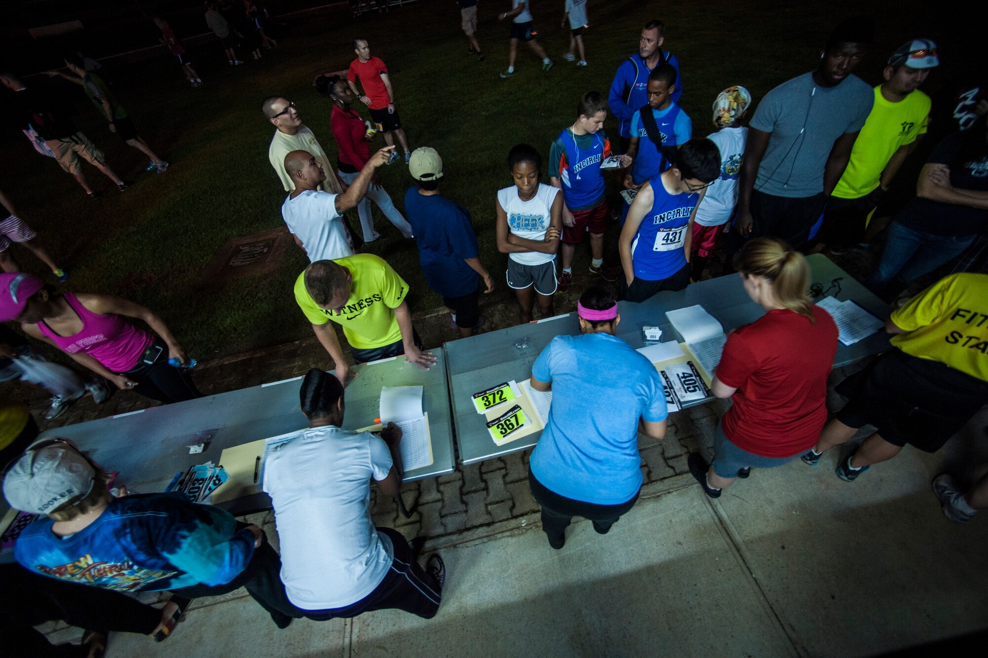 The 39th Force Support Squadron fitness center staff sign Airmen in at Incirlik’s annual Air Force half-marathon Sept. 14, 2013, at Incirlik Air Base, Turkey. The event gives avid runners and marathon participants a sense of home since they will not make it to the state-side annual Air Force marathon. (U.S. Air Force photo by Airman 1st Class Nicole Sikorski/Released)