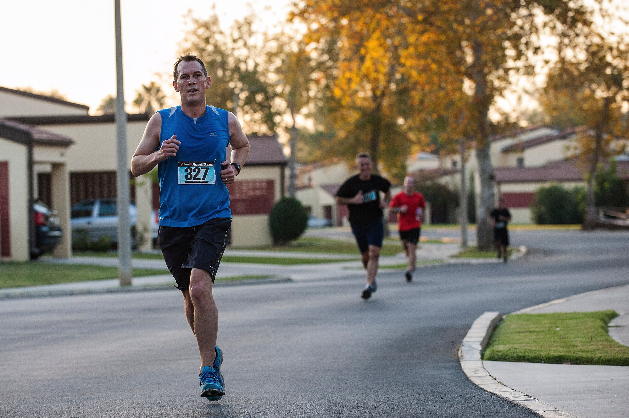 The first groups of marathon participants run toward a water station during the annual Air Force half-marathon Sept. 14, 2013, at Incirlik Air Base, Turkey. The 13.1-mile race was completed by individual runners and by four-person teams that divided the length of the race so that each person ran 3.25 miles. (U.S. Air Force photo by Airman 1st Class Nicole Sikorski/Released) 