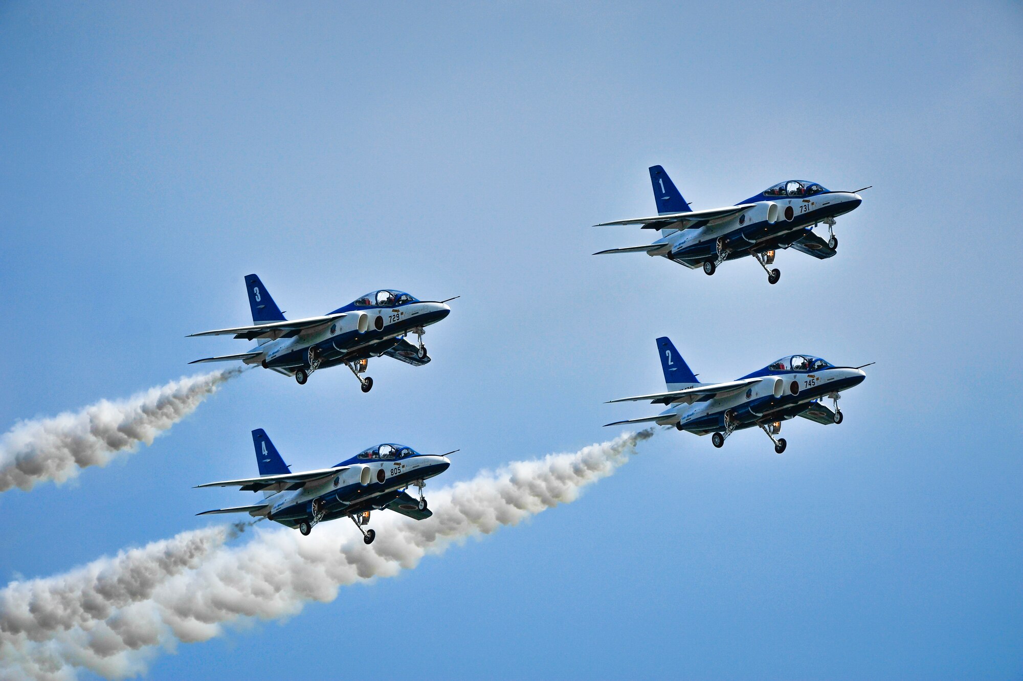 The Japan Air Self-Defense Force's demonstration team, Blue Impulse, flies over Misawa Air Base, Japan, Sept. 14, 2013. The team visited the area in conjunction with the annual air festival, which thousands of visitors attend to photograph and learn about military aircraft. (U.S. Air Force photo by Staff Sgt. Nathan Lipscomb)