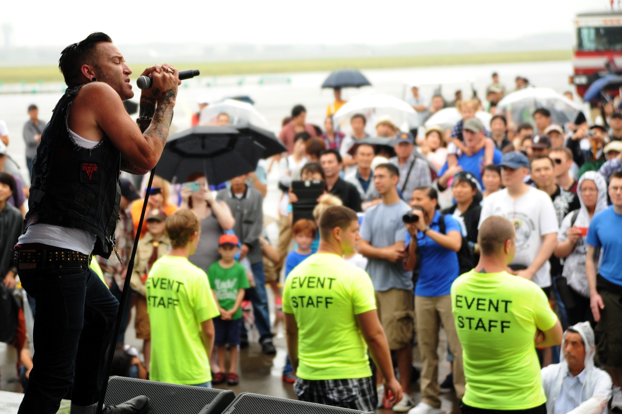 A. Jay Popoff, lead singer of the alternative band Lit, sings to a crowd during the air festival at Misawa Air Base, Japan, Sept. 15, 2013. More than 80,000 people attended the air festival, where the band wrapped up their final show of a two-week tour to military bases in Japan.  (U.S. Air Force photo by Senior Airman Derek VanHorn)