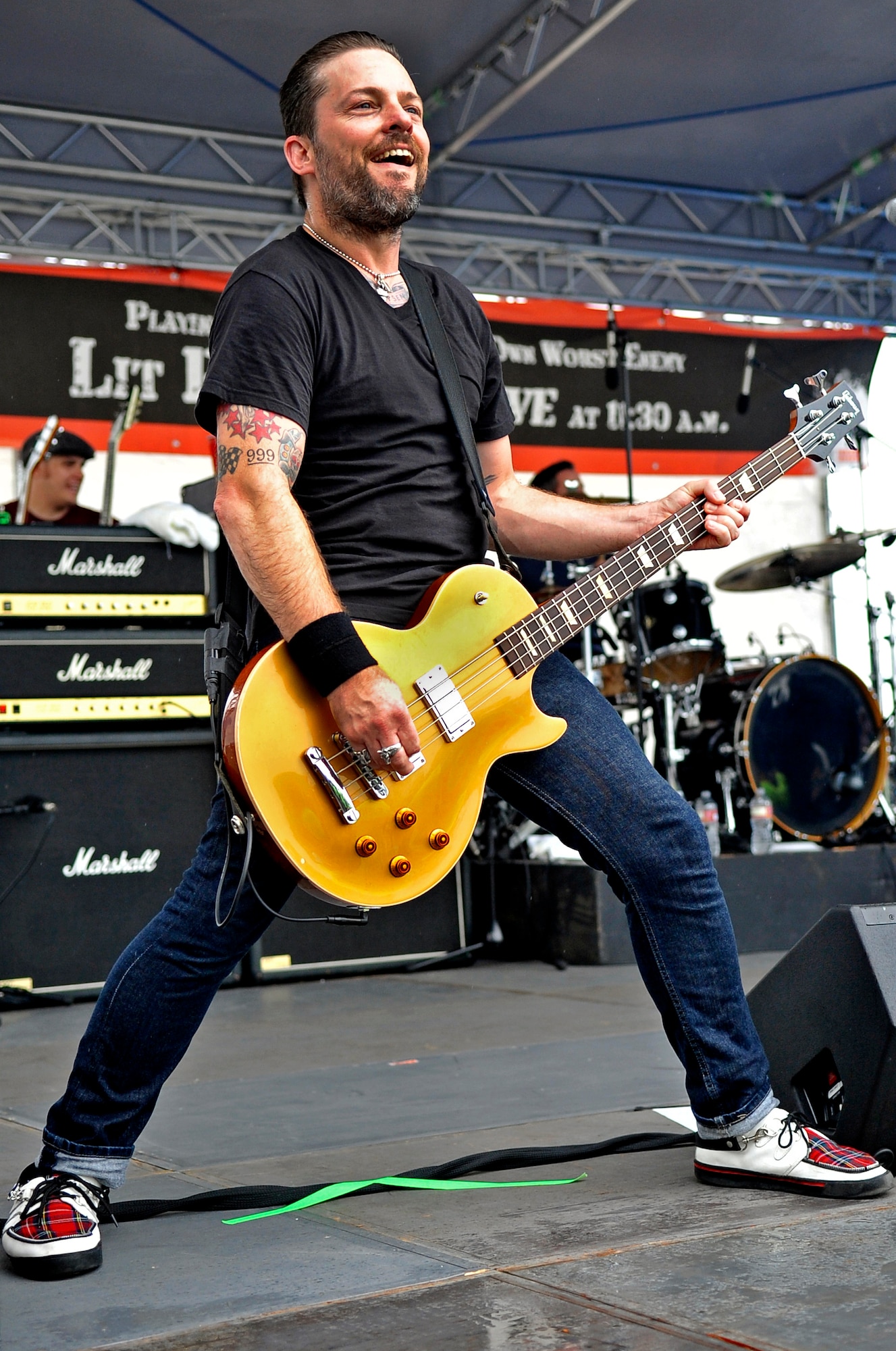 Kevin Baldes, bass guitarist for the alternative band Lit, plays for an audience during the 2013 Air Festival at Misawa Air Base, Japan, Sept. 15, 2013. Baldes and the band toured several military bases in Japan, before making a final stop in Misawa to give more than 80,000 people the opportunity to hear them play a few of their top hits. (U.S. Air Force photo by Airman 1st Class Zachary Kee)