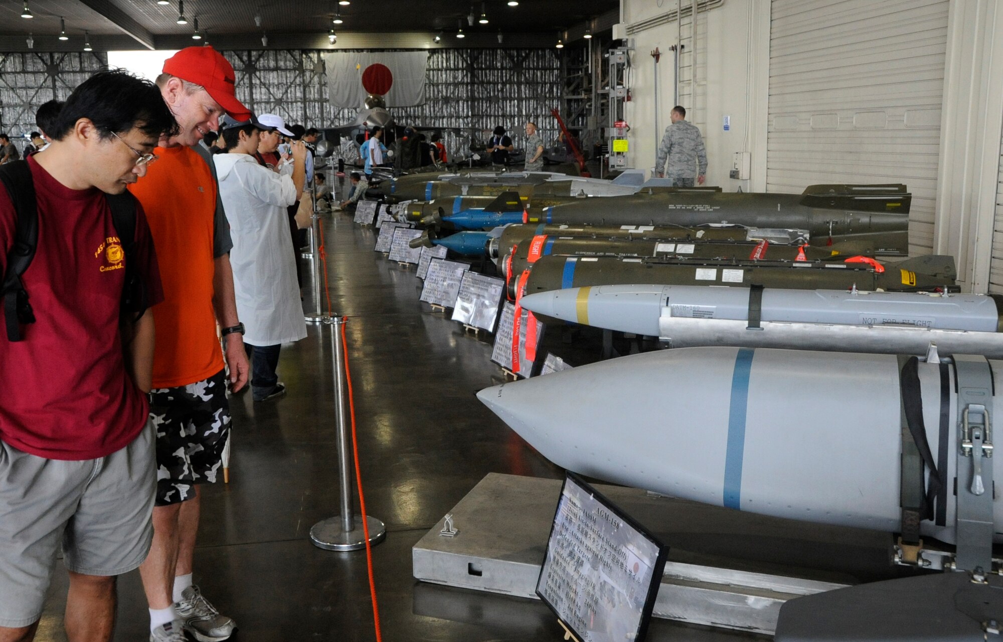 Attendees of the Misawa Air Festival 2013 view an array of explosive ordnance on display at Misawa Air Base, Japan, Sept. 15, 2013. More than 80,000 people from Japan and Misawa Air Base attended the Air Festival despite the rainy weather. (U.S. Air Force photo by Airman 1st Class Kaleb Snay)