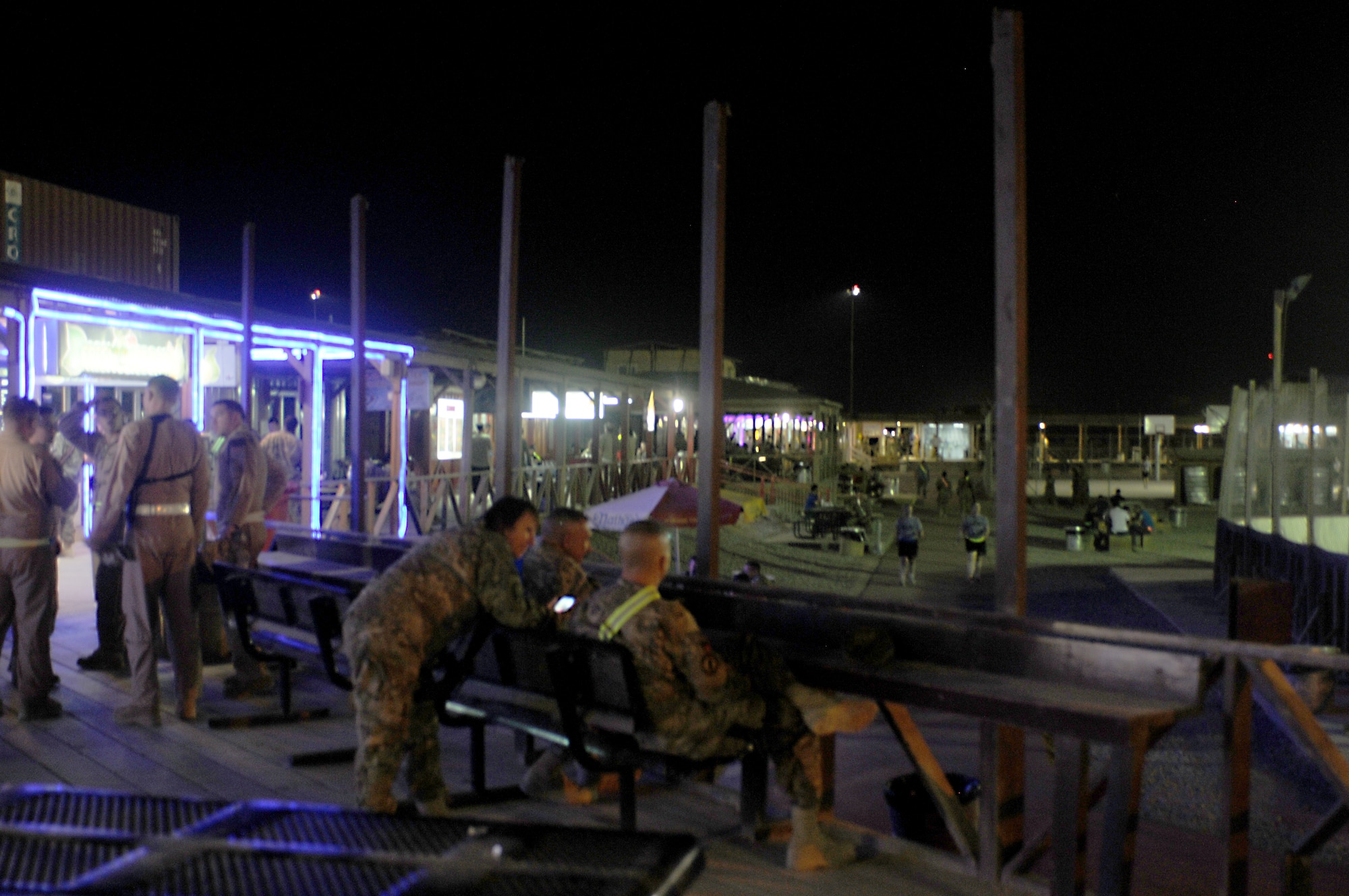 Coalition forces enjoy the Kandahar Boardwalk Aug. 16, 2013. The vendors on the boardwalk will begin closing in phases as part of the overall drawdown at Kandahar Airfield. The boardwalk has become an iconic part of KAF and its closure is one of the most visible symbols the mission is ending. (U.S. Air Force photo/Senior Airman Jack Sanders)