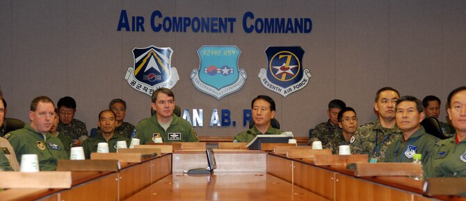 OSAN AIR BASE, Republic of Korea - Air Force Lt. Gen. Jan-Marc Jouas, 7th Air Force commander, and Republic of Korea Air Force Lt. Gen. Choi Cha-Kyu, ROK Air Force Operations commander, are briefed along with more than 70 U.S. and Korean air unit leaders during 7th AF's annual Air Boss Conference Sept. 13. The conference brought together air power leaders from every branch of the military to receive guidance from Jouas on his expectations and vision in regards to the ever-changing Korean political and military landscape. (U.S. Air Force photo by Tech. Sgt. Thomas J. Doscher)