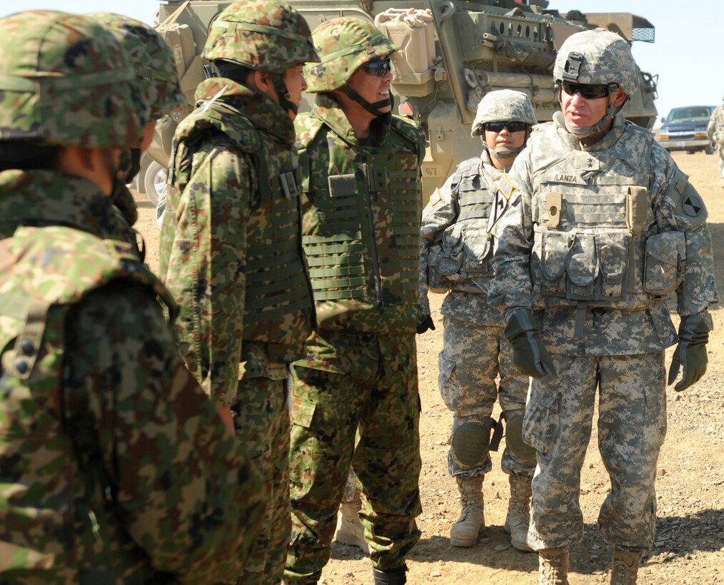 U.S. Army Maj. Gen. Stephen R. Lanza, right, commander of the 7th Infantry Division, meets Japanese Maj. Gen. Takeyoshi Omari, deputy commander of 4th Division, Japan Ground Self-Defense Force, during Rising Thunder at the Yakima Training Center, Wash., Sept. 13, 2013. Rising Thunder is a U.S. Army-hosted exercise designed to build interoperability between 1st Corps, the 7th Infantry Division and the Japan Ground Self-Defense Force. U.S. Army photo by 1st Sgt. Jason Shepherd