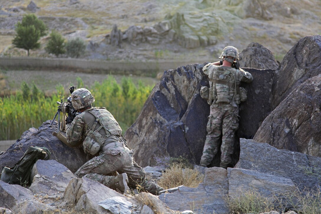 U.S. Army Pfc. Kyle York, left, and U.S. Army Pfc. Damien Patton provide overwatch from the mountains of Maiden Shar in Afghanistan's Wardak province, Sept. 1, 2013. York, a saw gunner, and Patton, a combat medic, are assigned to Company A, 3rd Battalion, 15th Infantry Regiment.
