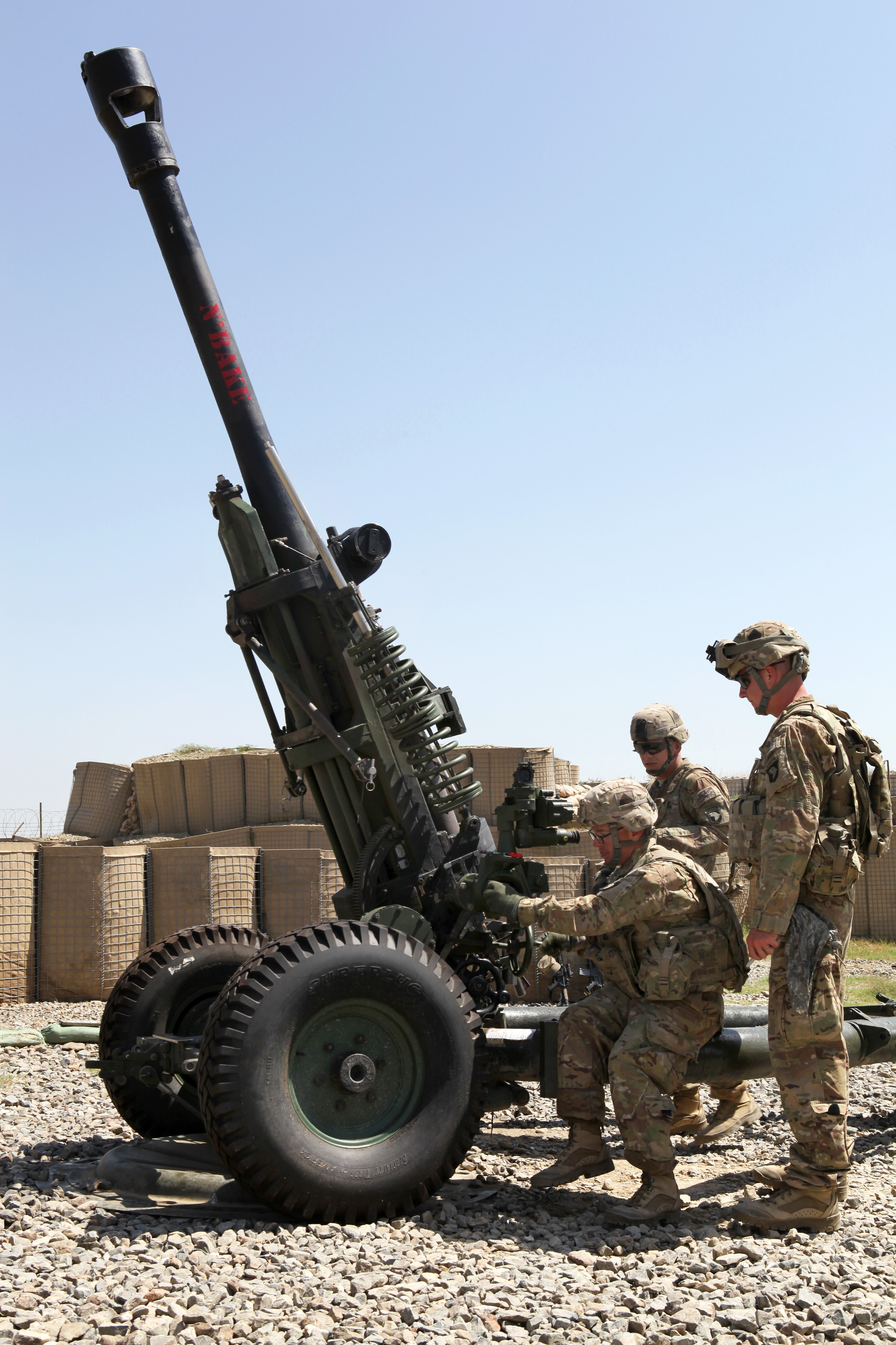 U.S. soldiers perform a high fire drill on M119A 105mm howitzer during the Guns of Glory top gun competition on Combat Outpost Chamkani in Khost province, Afghanistan, Sept. 4, 2013.