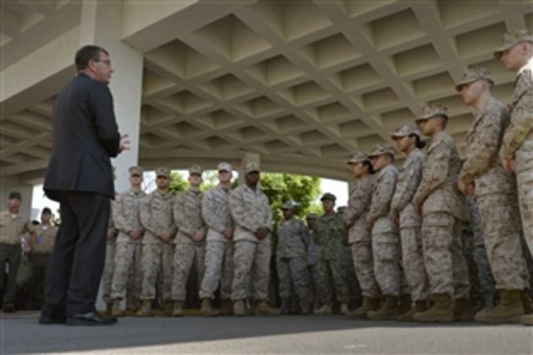 U.S. Deputy Defense Secretary Ash Carter thanks U.S. Marines and other forces assigned to the U.S. Embassy in Islamabad for their service while visiting the city, Sept. 16, 2013.
