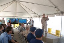 Lt. Gen. Richard T. Tryon, Commander, U.S. Marine Corps Forces Command (MARFORCOM) addresses key leadership on the role of the Active Denial System at a demonstration of the system at Joint Base Langley-Eustis, Sept. 12. The ADS uses millimeter wave technology as a non-lethal compliance system. The demonstration was used to show the effectiveness of the system during maritime operations.