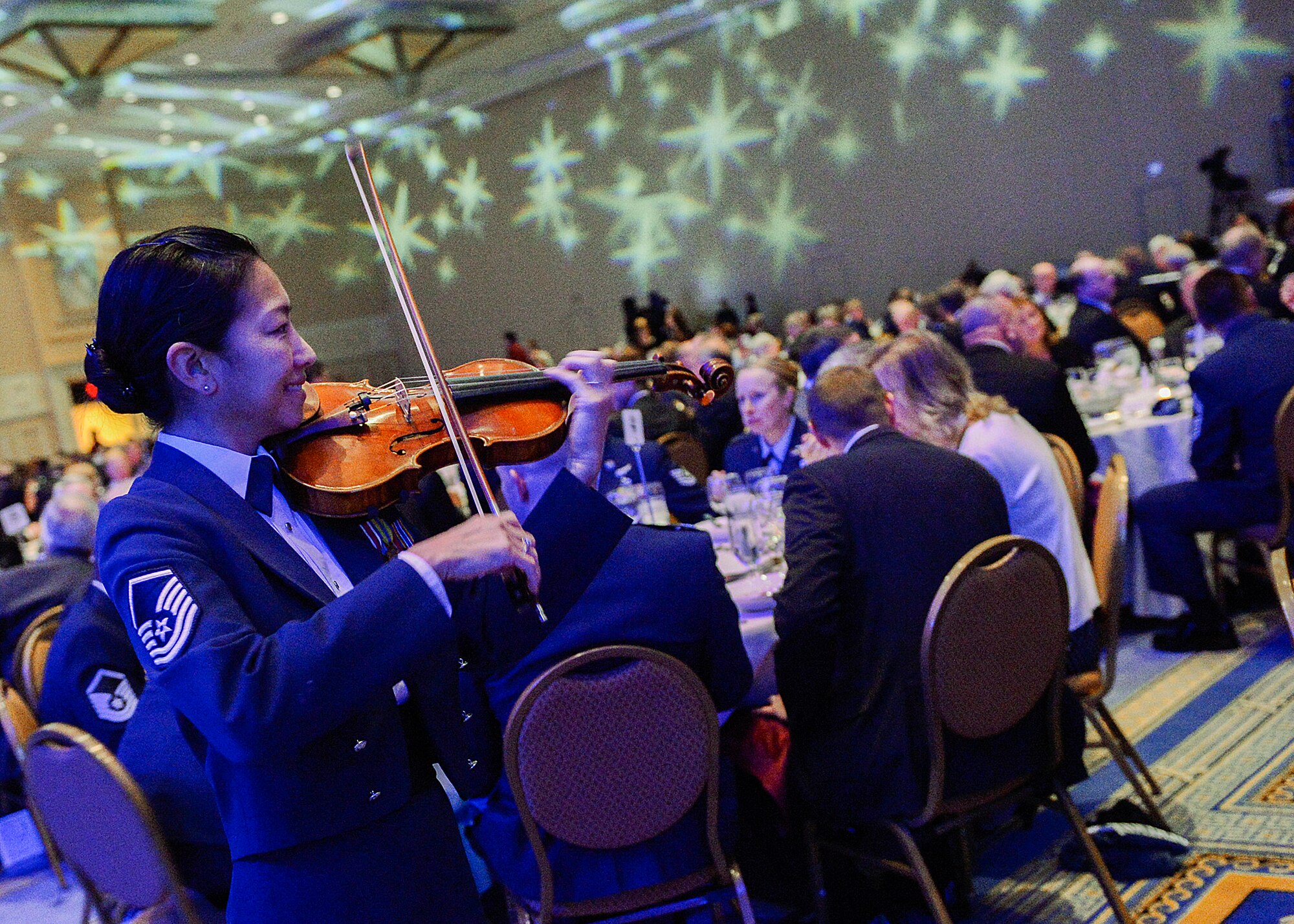 The United States Air Force Band performs during the Outstanding Airmen of the Year reception and awards dinner hosted by the Air Force Association during the AFA's annual Air & Space Conference and Technology Exposition Sept. 16, 2013, in Washington, D.C. The OAY award recognizes the top 12 outstanding enlisted Airmen for superior leadership, job performance, community involvement, and personal achievements. The program was initiated at the Air Force Association's 10th annual national conference, held in New Orleans in 1956.(U.S. Air Force photo/Jim Varhegyi)