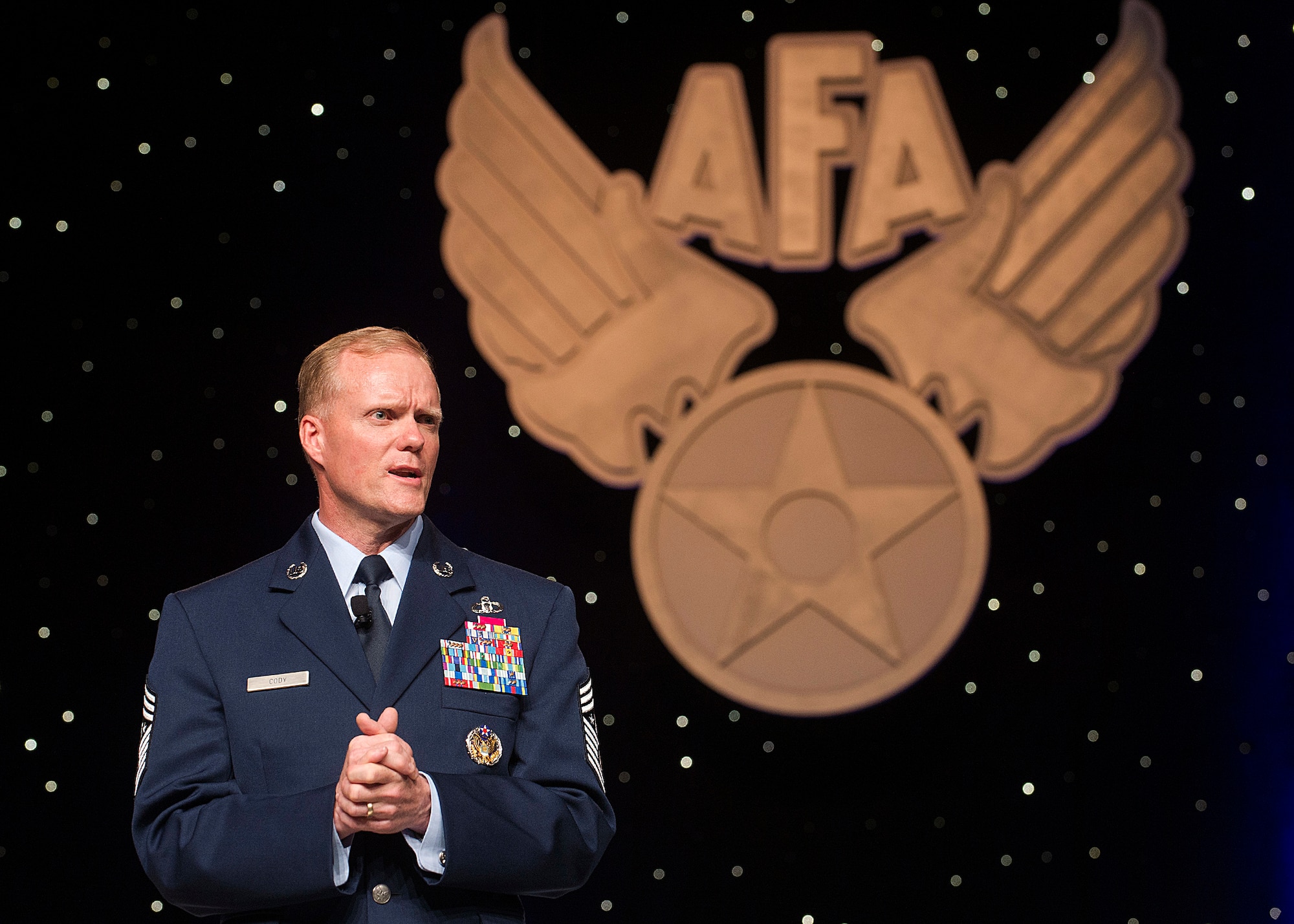 Chief Master Sgt. of the Air Force James Cody speaks at the Outstanding Airmen of the Year dinner during the Air Force Association's annual Air & Space Conference and Technology Exposition Sept. 16, 2013, in Washington, D.C. The award recognizes the top 12 outstanding enlisted Airmen for superior leadership, job performance, community involvement and personal achievements.(U.S. Air Force photo/Jim Varhegyi)