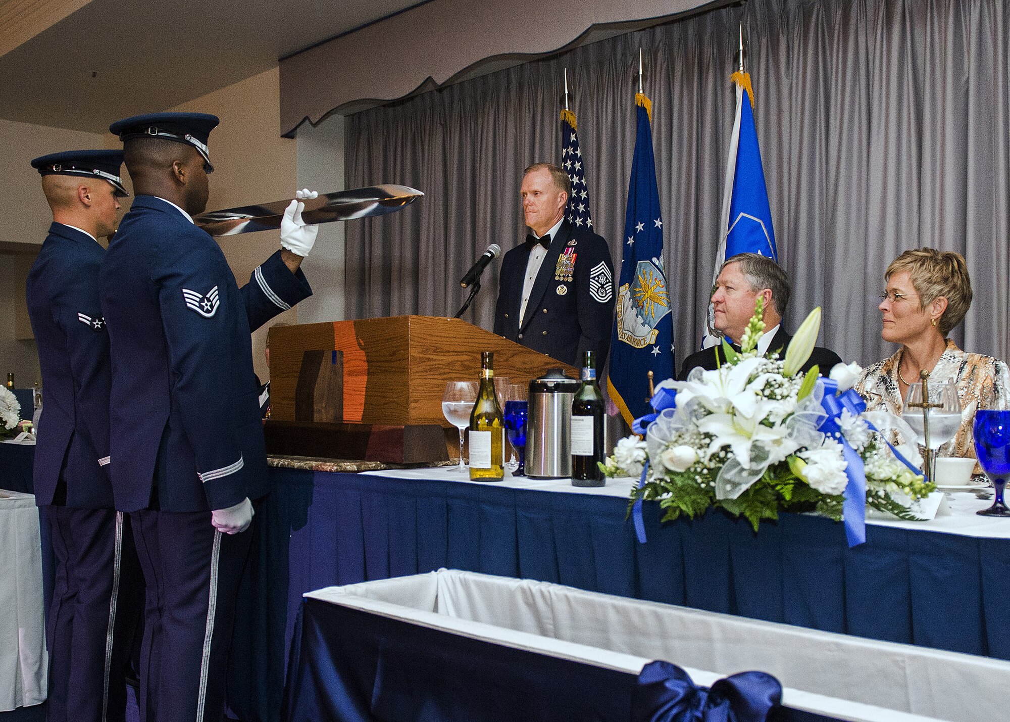 Chief Master Sgt. of the Air Force James Cody inducts the former Secretary of the Air Force Michael Donley into the Order of the Sword during a ceremony on Joint Base Anacostia Bolling, Washington, D.C. on Sept. 13, 2013. 