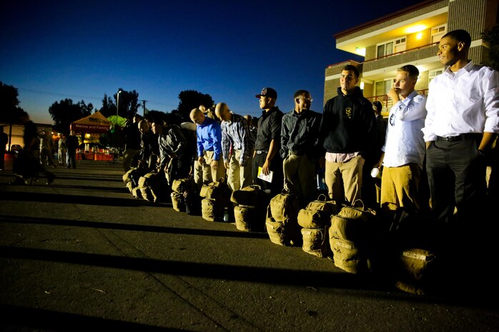 Marines and sailors with Bravo Company, 1st Battalion, 1st Marine Regiment, take accountability before boarding a bus for deployment at the Camp Horno parade deck here, Sept. 14, 2013. Marines with the company will provide site security at an embassy in the Middle East. The servicemembers focused on nonlethal training for scenarios similar to rioting civilians prior to their deployment.