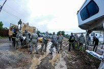 U.S. Soldiers and Airmen with the Colorado National Guard and civilian emergency responders distribute sandbags in response to floods in Jefferson County, Colo., Sept. 15, 2013. Colorado and Wyoming National Guard units were activated to provide assistance to people affected by massive flooding along Colorado?s Front Range. (U.S. Air National Guard photo by Staff Sgt. Nicole Manzanares/Released)