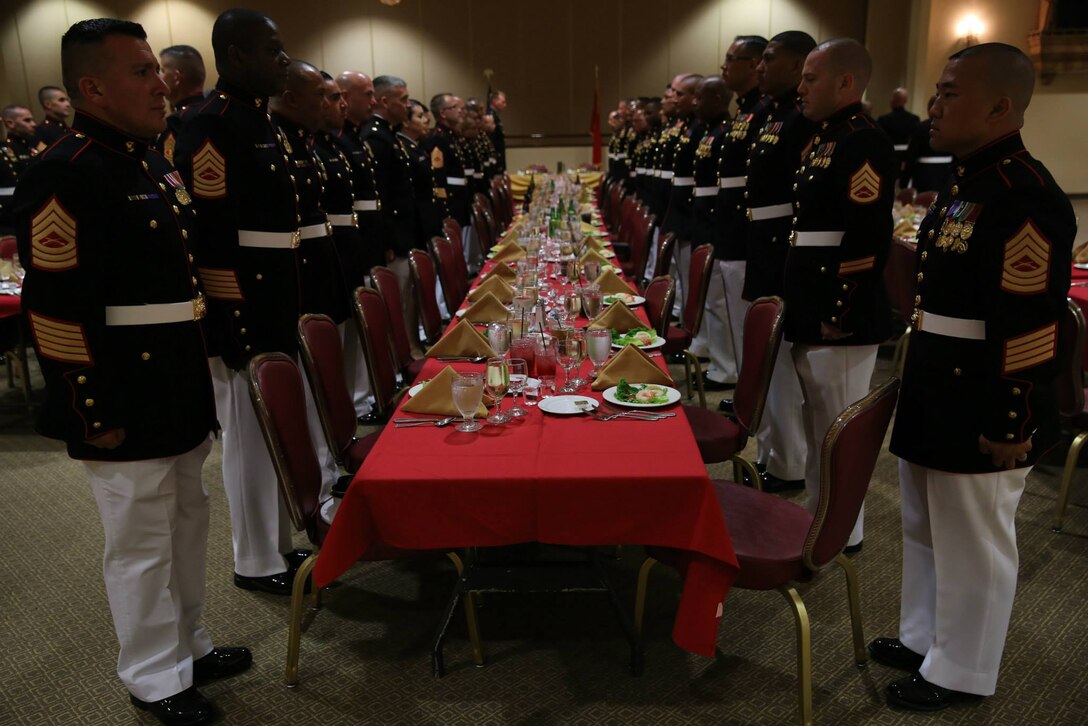 Career Recruiters with the 12th Marine Corps District stand in a mess-night during a three-day recruiting seminar at Marine Corps Base Camp Pendleton, Calif., Aug. 10-12. Career Recruiters attend this seminar to develop professionally and learn methods of leadership. The three days include high intensity interval training (HIIT), various classes, tactical training and a mess-night.