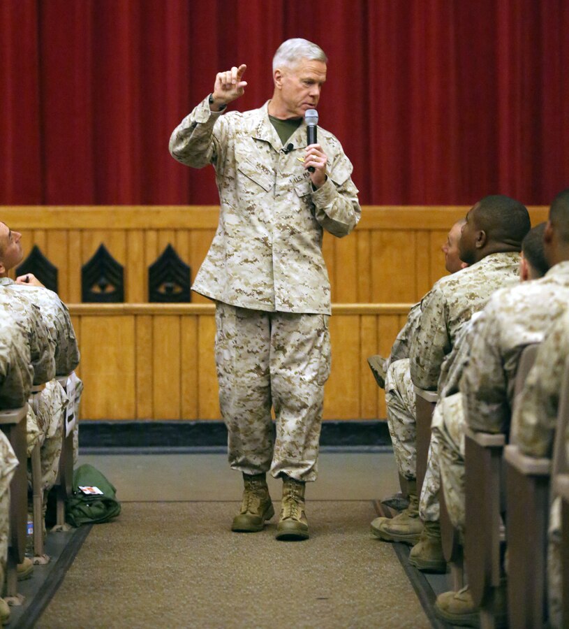 General James Amos, commandant of the Marine Corps, speaks with non-commissioned officers in 2nd Marine Division, Sept. 17, 2013, aboard Marine Corps Base Camp Lejeune. His talk included thoughts on the budget cuts the Marine Corps is facing, and how he plans to adapt to having less spending money. He said that even with the limited amount of money available to Corps, we will continue to fulfill our mission as amphibious warfighters.