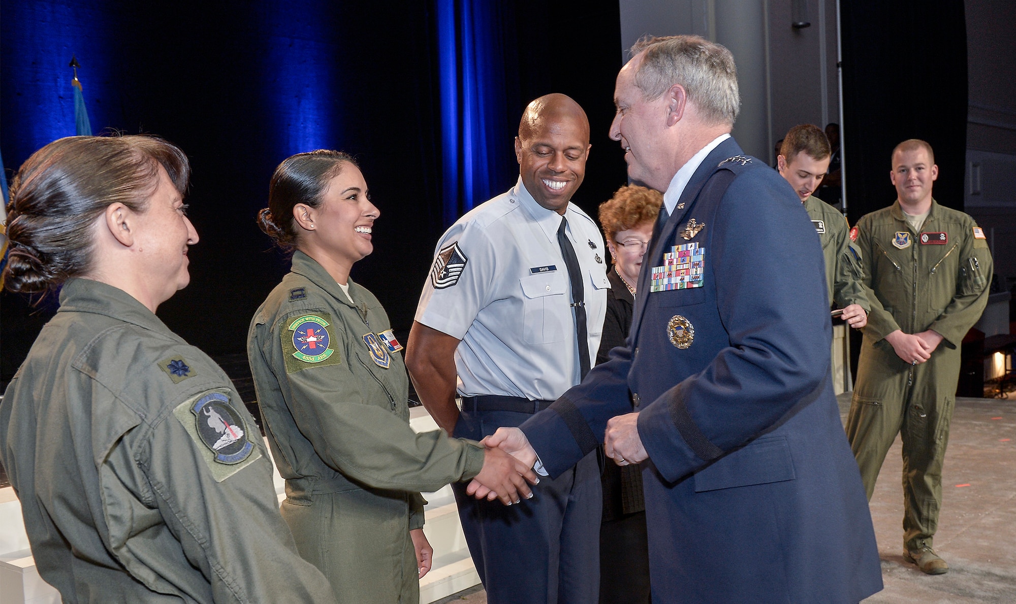 Air Force Chief of Staff Gen. Mark A. Welsh III shakes hands with Airmen who he highlighted during his Air Force Update keynote address during the Air Force Association's 2013 Air & Space Conference and Technology Exposition Sept. 17, 2013, in Washington, D.C. During his address, Welsh emphasized how each Airman contributes to Global Vigilance, Global Reach and Global Power for America. (U.S. Air Force photo/Michael J. Pausic) 