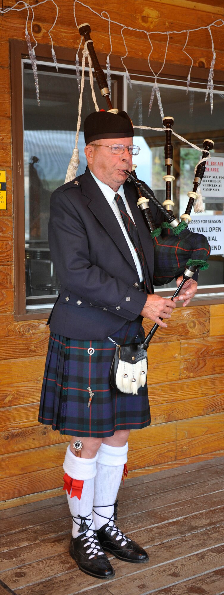 Tony Barrett, Anchorage Senior Activity Center secretary, performs for families during the 3rd annual Family Activity Night on Joint Base Elmendorf-Richardson Sept. 11. Barrett played his traditional bagpipes in remembrance of the fallen heroes who lost their lives on September 11. SOS hosted the event to help families recover from traumatic experiences, assure them their loss is valued and remembered, and to remind them that they are not alone. (U.S. Air Force photo/Airman 1st Class Tammie Ramsouer)