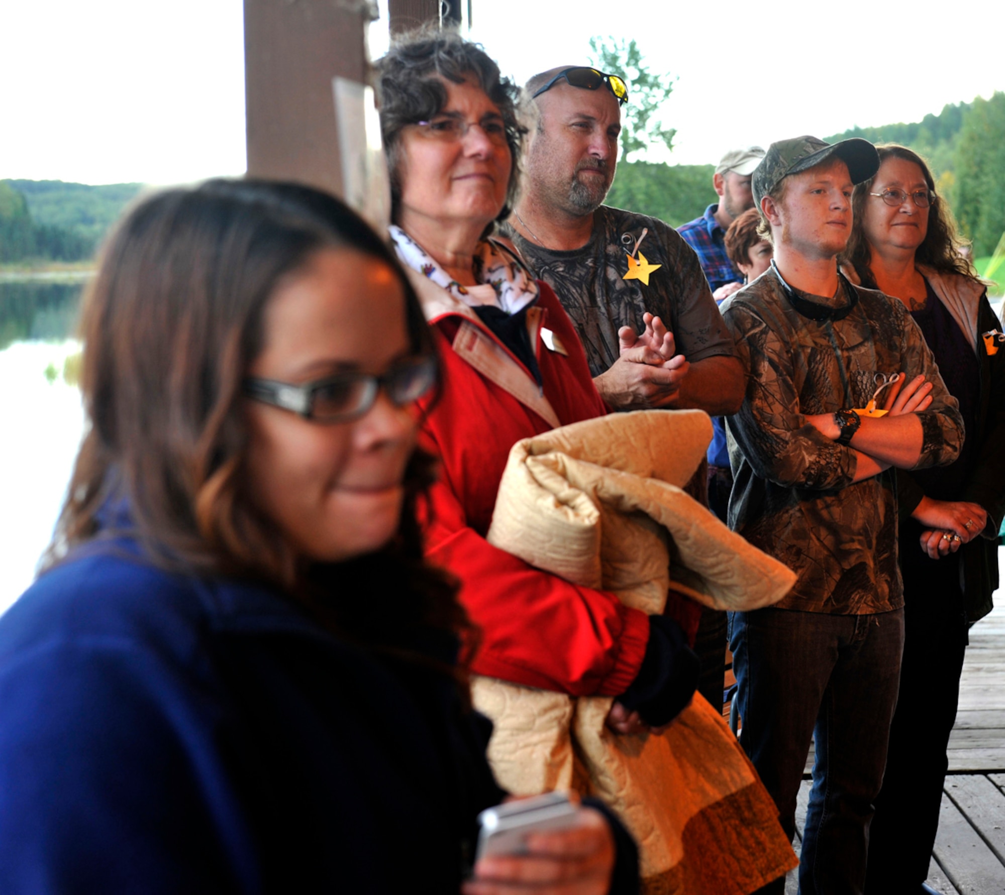 Military families watch a bagpiper play traditional bagpipes during the 3rd annual Family Activity Night on Joint Base Elmendorf-Richardson Sept. 11. The event was an opportunity for families who have lost service members to connect with each other and create support groups. (U.S. Air Force photo/Airman 1st Class Tammie Ramsouer)
