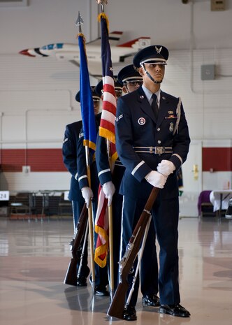 The Nellis Air Force Base Honor Guard presents the colors during Retiree Appreciation Day at the Thunderbirds’ Hangar Sept. 13, 2013, at Nellis Air Force Base, Nev. The honor guard represents the Air Force in ceremonial functions in southern Nevada, Arizona, Utah and some areas of California. (U.S. Air Force photo by Airman 1st Class Jason Couillard)