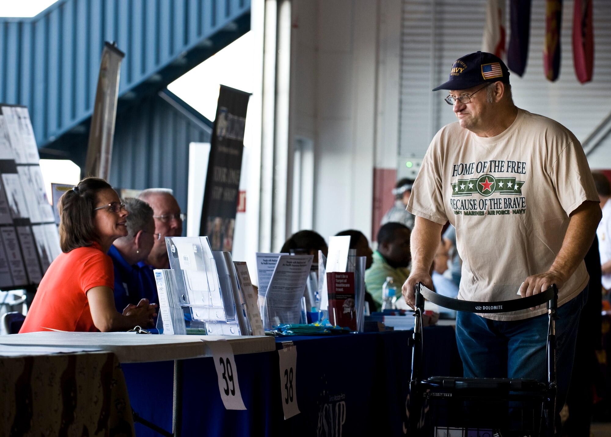 James Hoban, U.S. Navy retiree, browses information booths during Retiree Appreciation Day at the Thunderbirds’ Hangar Sept. 13, 2013, at Nellis Air Force Base, Nev.  More than 800 retirees and their families attended, receiving information, food and entertainment. (U.S. Air Force photo by Airman 1st Class Jason Couillard)