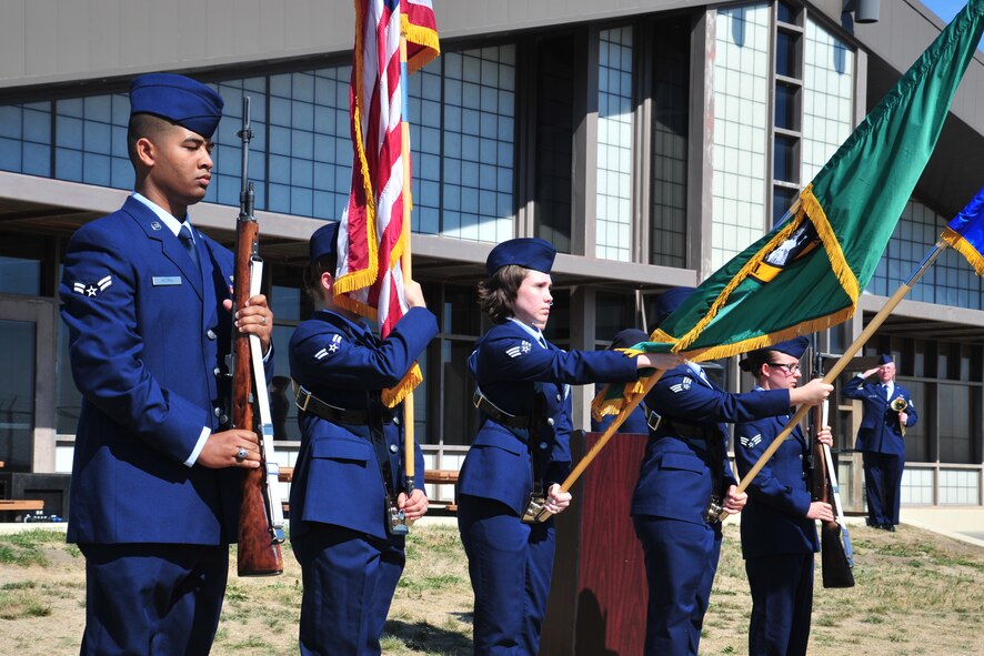 New members of Fairchild's Honor Guard present the colors prior to a mock full-honors funeral ceremony during the honor guard graduation at Fairchild Air Force Base, Wash., Sept. 13, 2013. (U.S. Air Force photo by Staff Sgt. Michael Means/Released)