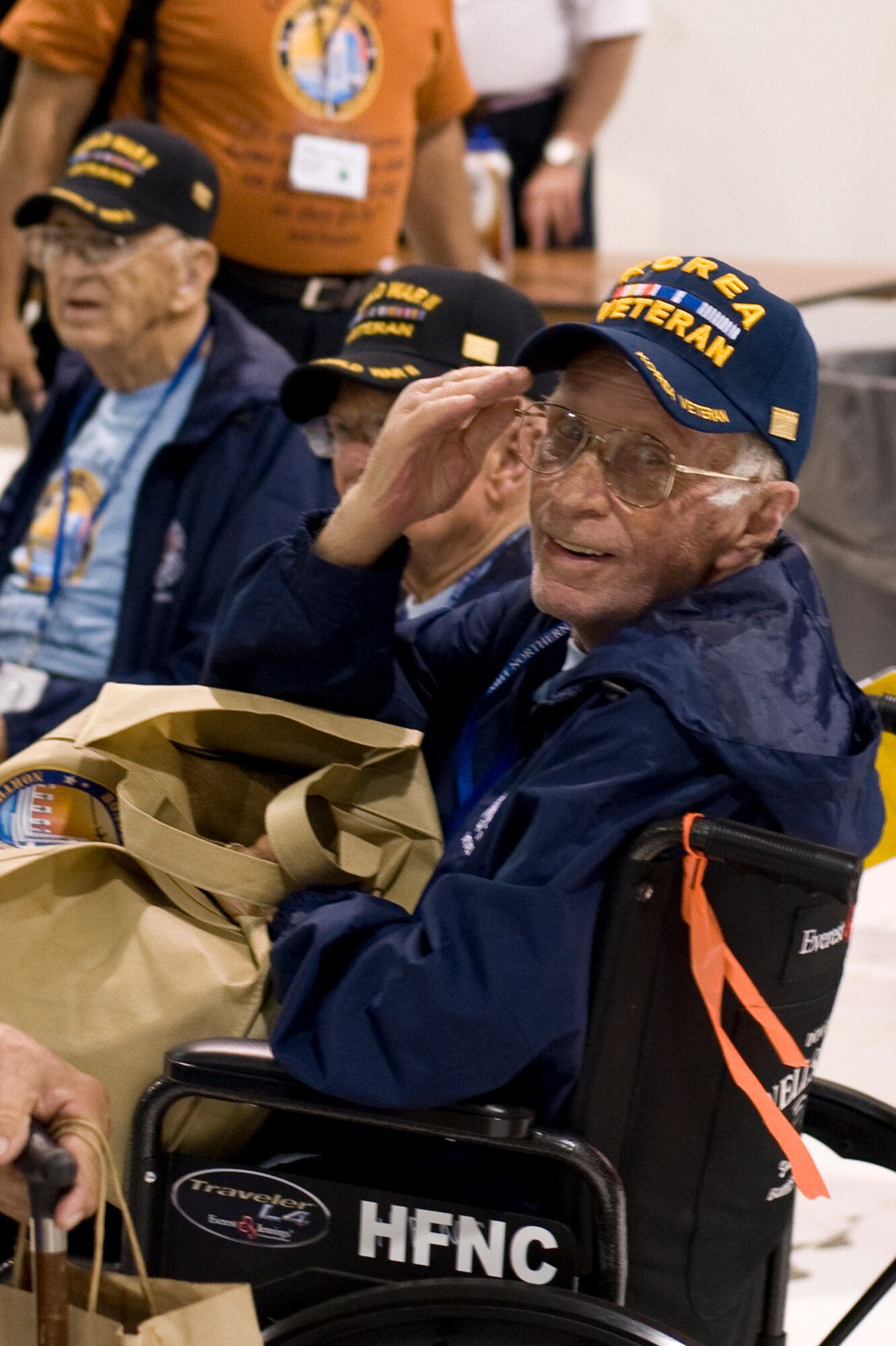 A Korean War veteran renders a salute Sept. 16, 2013, at the Denver International Airport. The 124 veterans were returning from a trip to Washington where they saw the monuments constructed in their honor. Honor Flight Northern Colorado offers free trips to the district for World War II and Korean War veterans, as well as Purple Heart recipients from any war. (U.S. Air Force photo by Airman 1st Class Riley Johnson/Released)
