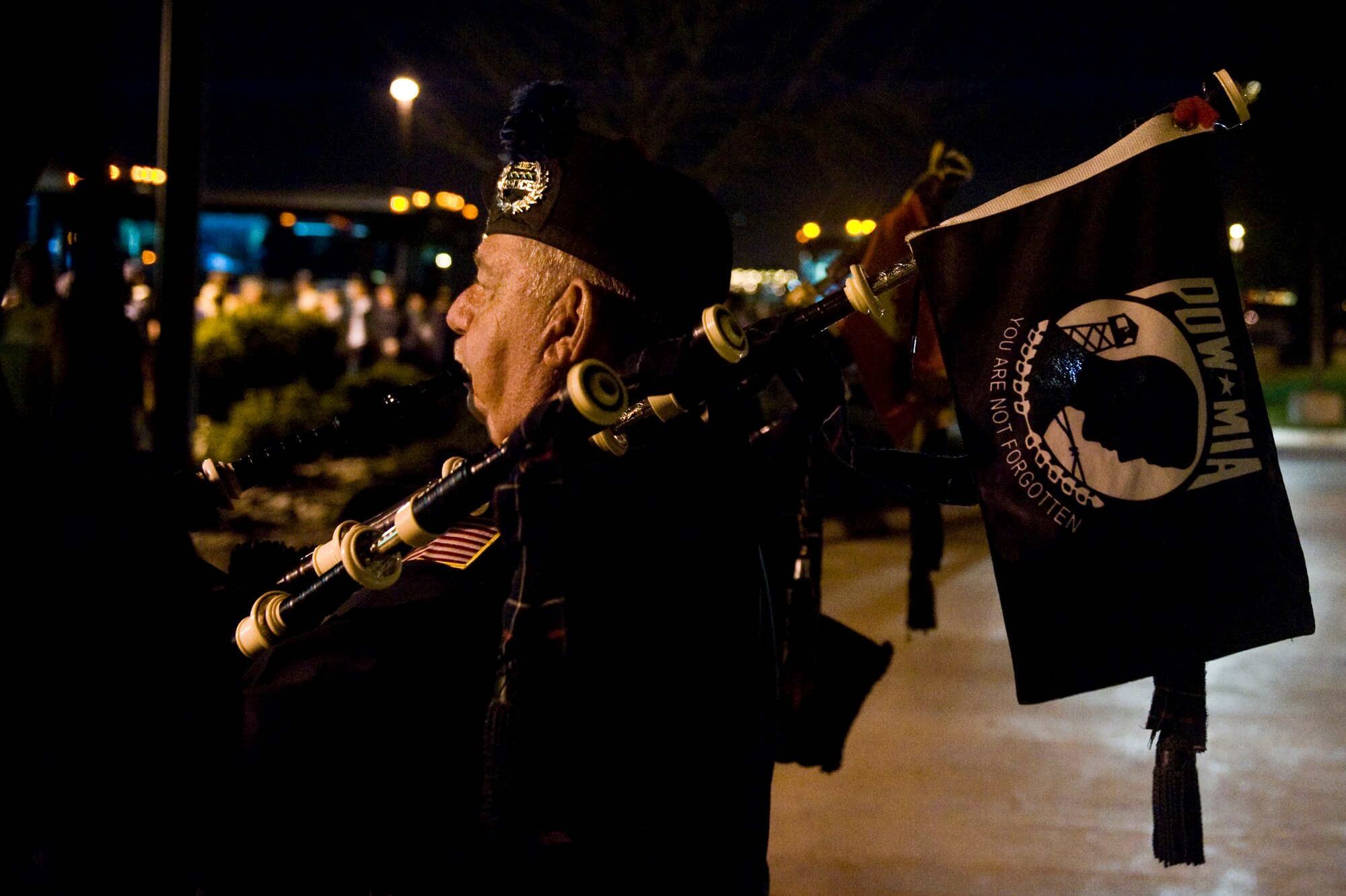 An El Jebel Shrine Pipe Band Bagpiper plays the Armed Forces Medley to veterans returning home Sept. 16, 2013, at the Denver International Airport. The 124 veterans were returning from a trip to Washington where they saw the monuments constructed in their honor. Honor Flight Northern Colorado offers free trips to the district for World War II and Korean War veterans, as well as Purple Heart recipients from any war. (U.S. Air Force photo by Airman 1st Class Riley Johnson/Released)