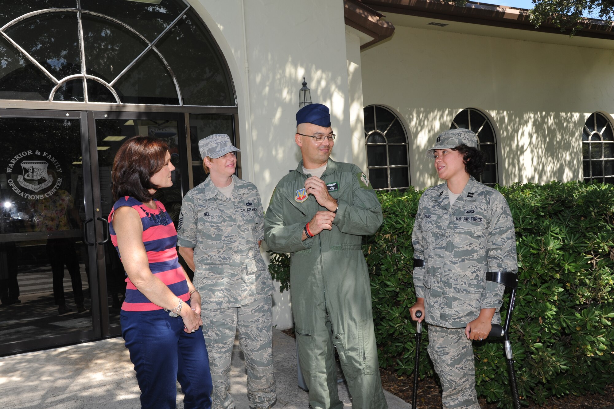 Betty Welsh (left), wife of Air Force Chief of Staff Gen. Mark A. Welsh III, visits with wounded warriors outside the Warrior and Family Operations Center during her visit to the Air Force Personnel Center on Joint Base San Antonio-Randolph, Texas, Sept. 11, 2013.  To Welsh’s left are Master Sgt. Sherri Nel, Master Sgt. Christopher Aguilera and Capt. Sarah Evans (U.S. Air Force photo by Melissa Peterson)