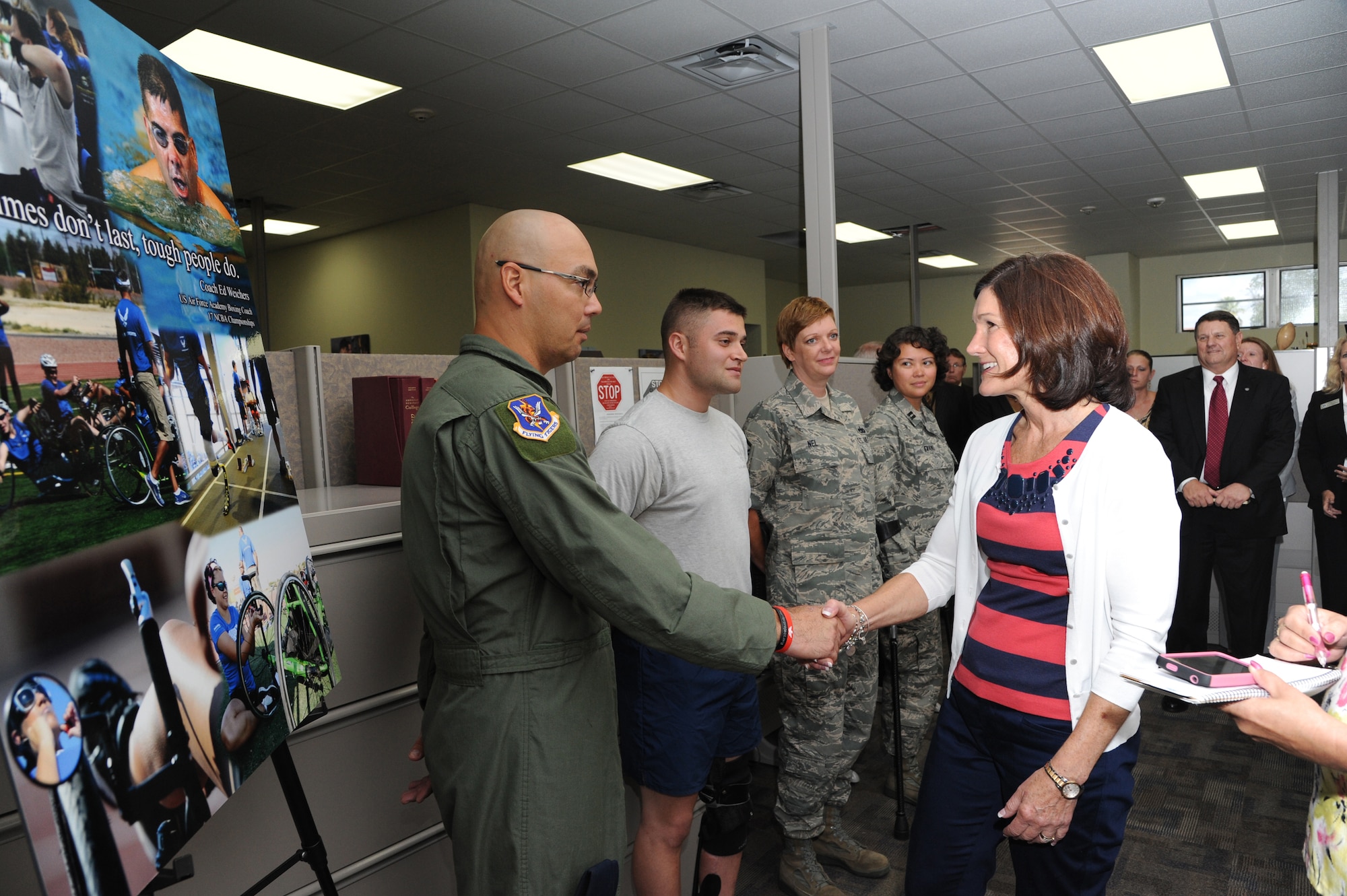 Betty Welsh, wife of Air Force Chief of Staff Mark A. Welsh III, meets Master Sgt. Christopher Aguilera, an Air Force wounded warrior, during a visit to the Air Force Personnel Center on Joint Base San Antonio-Randolph, Texas, Sept. 11, 2013.  Other wounded warriors she met during her visit include (from Aguilera’s left) Senior Airman Orion Orellano, Master Sgt. Sherri Nel and Capt. Sarah Evans (U.S. Air Force photo by Melissa Peterson).