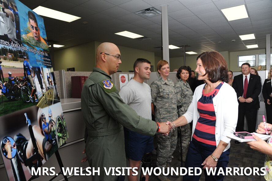 Betty Welsh, wife of Air Force Chief of Staff Mark A. Welsh III, meets Master Sgt. Christopher Aguilera, an Air Force wounded warrior, during a visit to the Air Force Personnel Center on Joint Base San Antonio-Randolph, Texas, Sept. 11, 2013.  Other wounded warriors she met during her visit include (from Aguilera’s left) Senior Airman Orion Orellano, Master Sgt. Sherri Nel and Capt. Sarah Evans (U.S. Air Force photo by Melissa Peterson).