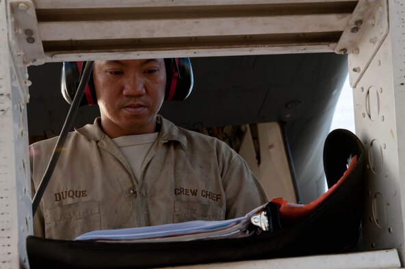 Staff Sgt. Mark Duque, 28th Aircraft Maintenance Squadron B-1 bomber crew chief, reviews aircraft maintenance procedures during a pre-flight inspection at Ellsworth Air Force Base, S.D., Sept. 10, 2013. Crew chiefs use technical data to diagnose and solve maintenance problems on aircraft systems and interpret procedures and policies to repair aircraft and related equipment. (U.S. Air Force photo by Airman 1st Class Zachary Hada/Released)