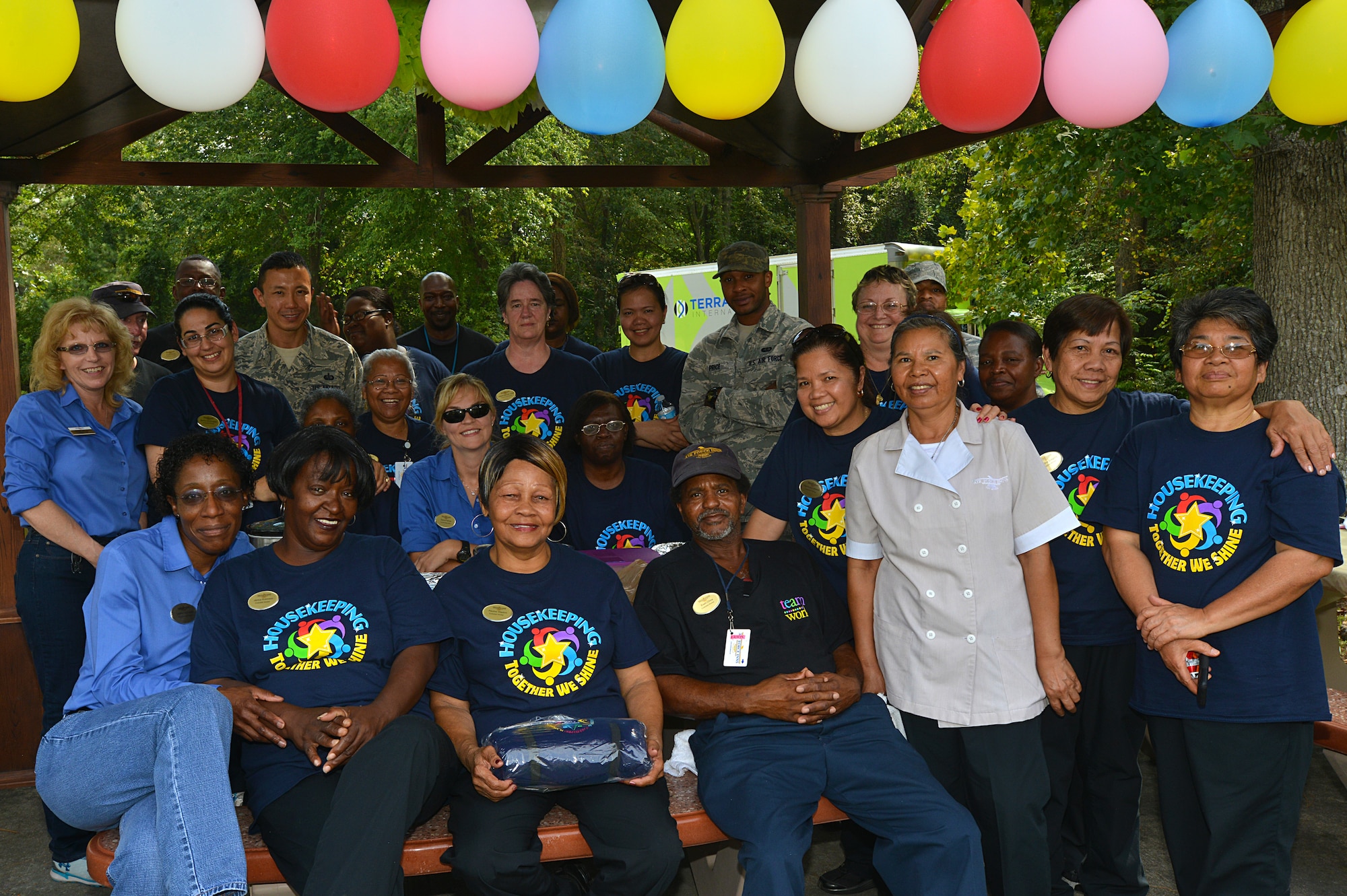 Carolina Pines Inn workers pose for a photo during international housekeeping week, Shaw Air Force Base, S.C., Sept. 13, 2013. International housekeeping week is an Air Force-wide event, held on many bases to show appreciation for the hard work that housekeepers do and give them a chance to relax and have fun. (U.S. Air Force photo by Airman 1st Class Jensen Stidham/Released)