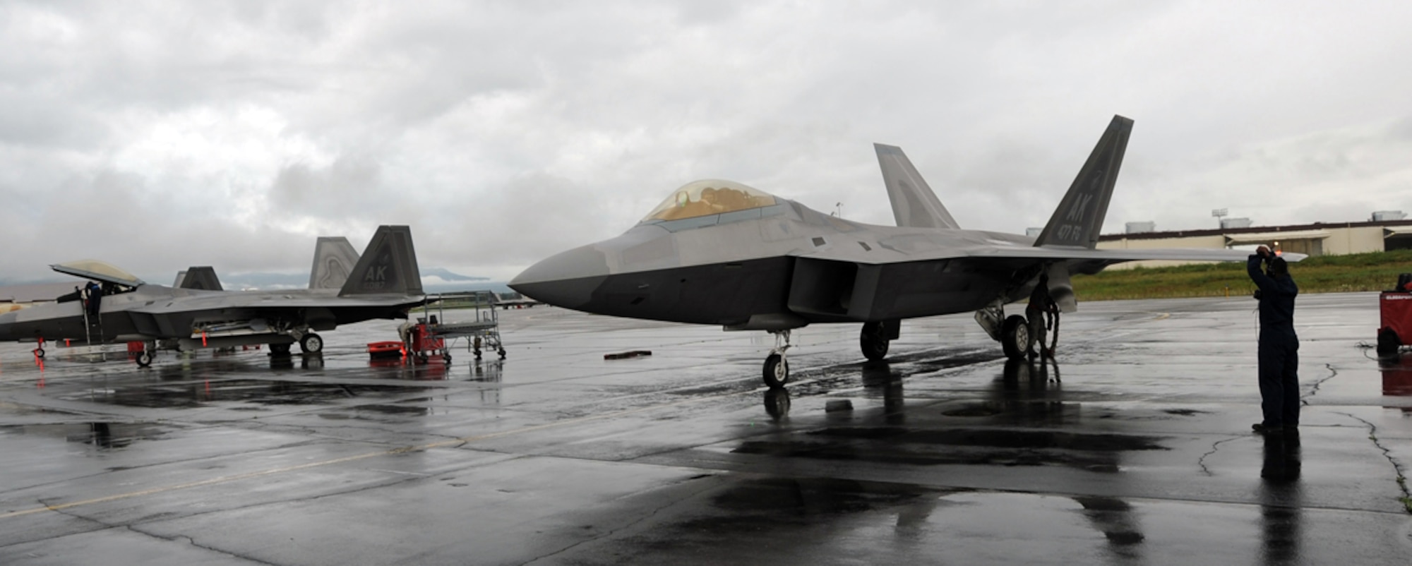 Crew chiefs with the 3rd Maintenance Squadron park two F-22 aircraft returning from an afternoon sortie. All aircraft are given post-flight inspections prior to being "put to bed" for the evening. (U.S. Air Force photo/By Air Force 2nd Lt. Michael Trent Harrington)