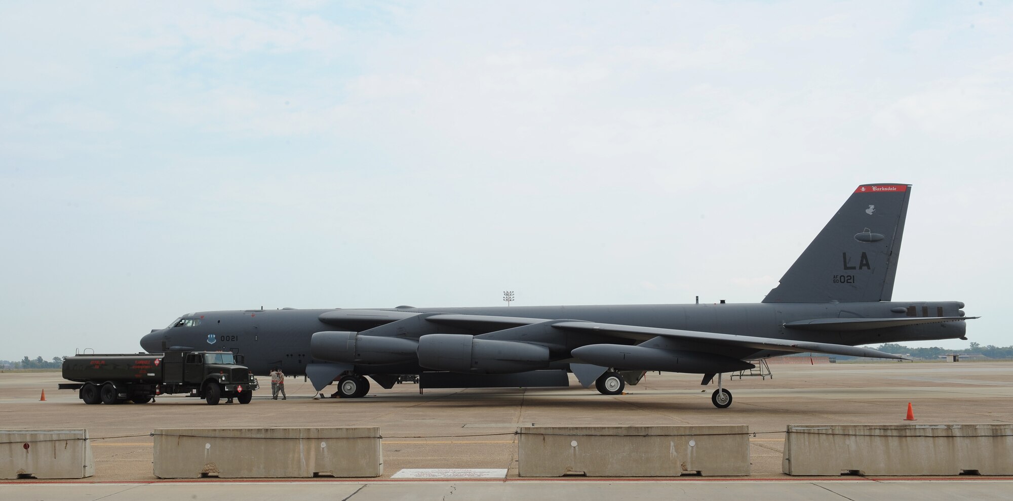 Fuels management Airmen from the 2nd Logistics Readiness Squadron finish a refueling operation on Barksdale Air Force Base, La., Sept. 17, 2013. Fuels Airmen work 24-hours a day, seven days a week to ensure the B-52H Stratofortress and all transient aircraft receive the fuel needed to continue their mission. (U.S. Air Force photo/Senior Airman Benjamin Gonsier)