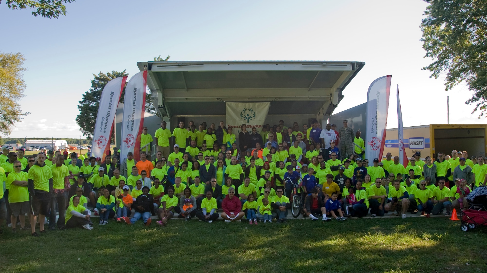 More than 300 volunteers participate in a group shot during the Special Olympics Sept. 14, 2013, on Dover Air Force Base, Del. Team Dover provided support to the Special Olympics by providing a location for the bicycle races, parking and volunteers. (U.S. Air Force photo/Senior Airman Jared Duhon)