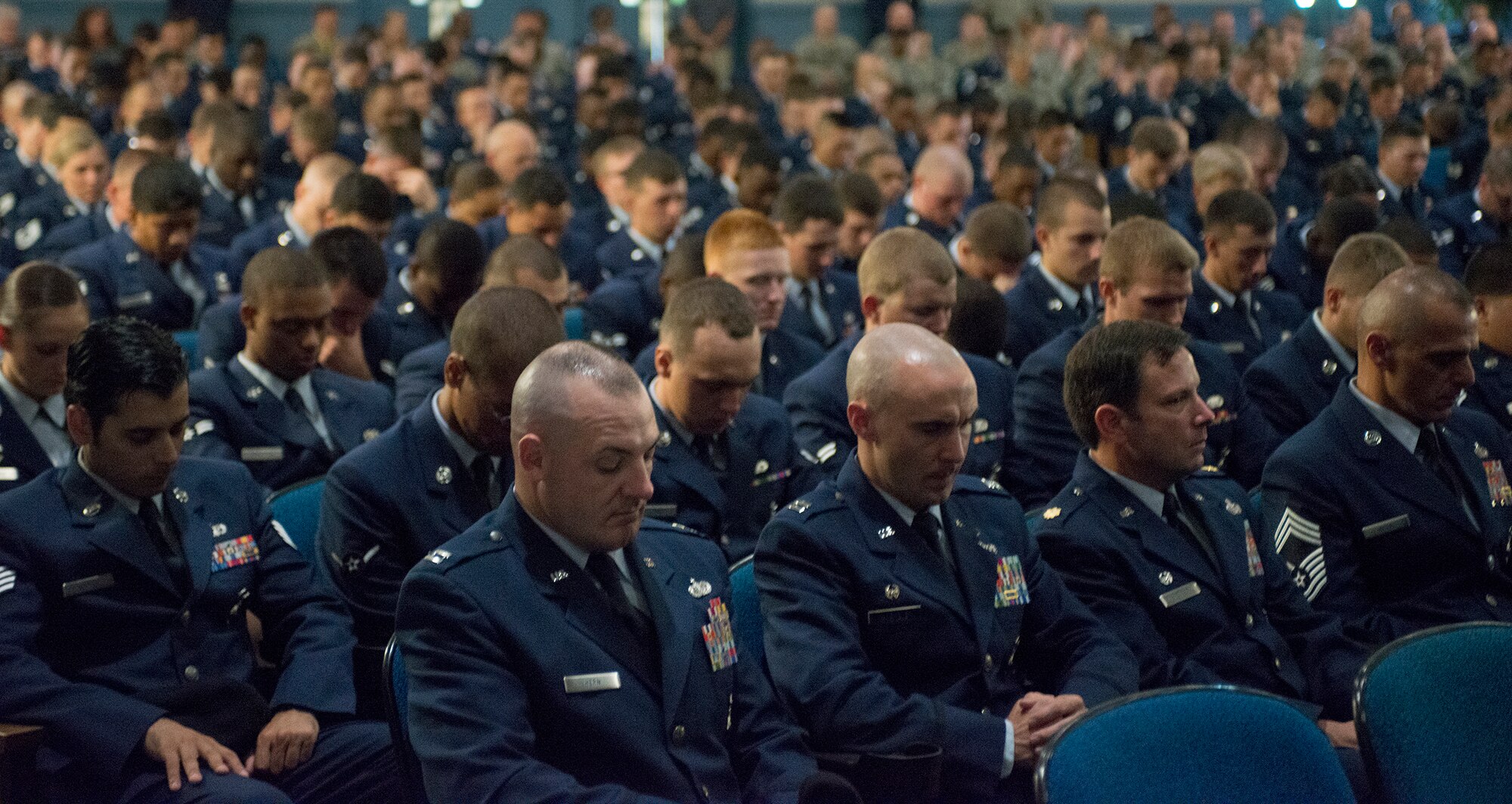 U.S. Air Force Airmen from the 820th Base Defense Group bow their heads during a memorial service for Staff Sgt. Todd Lobraico Jr. at Moody Air Force Base, Ga., Sept. 16, 2013. Lobraico trained and deployed with many 820th BDG Airmen. (U.S. Air Force photo by Airman 1st Class Ryan Callaghan/Released)

