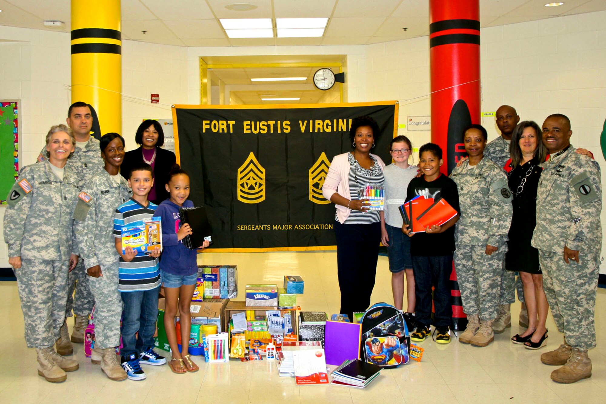 Members of the Fort Eustis Sergeants Major Association donate school supplies for students at the General Stanford Elementary School at Fort Eustis, Va., Sept. 10, 2013. The donation of the school supplies was the first official act of the recently-formed association, which was created to facilitate community outreach and address enlisted matters. (Courtesy photo/Released)