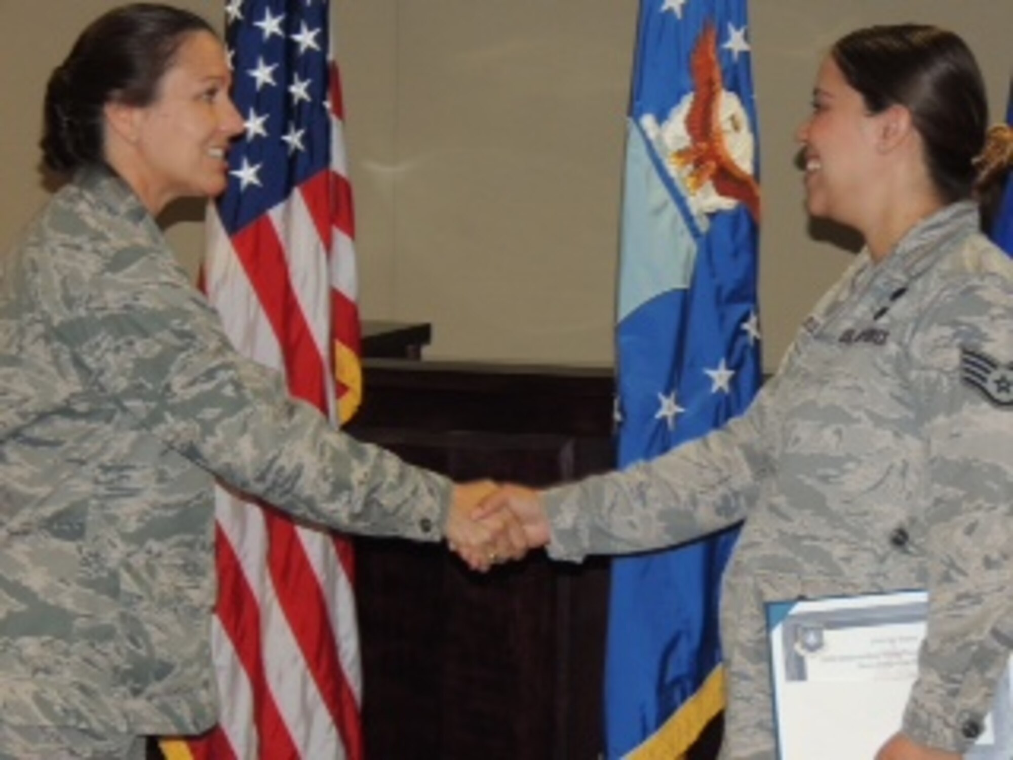 VANDENBERG AIR FORCE BASE, Calif. -- Brig. Gen. Linda S. Marchione, mobilization assistant to the commander of 14th Air Force, Vandenberg Air Force Base, Calif., congratulates Staff Sgt. Melissa Rush, non commissioned officer in charge of military justice at the 14th AF Staff Judge Advocate office, upon Rush’s acceptance of the Steve Swigonski Award Sept. 16, 2013. The award recognizes Rush as the Air Force’s most outstanding young paralegal of the year. (U.S. Air Force Photo/Maj. Larry van der Oord)