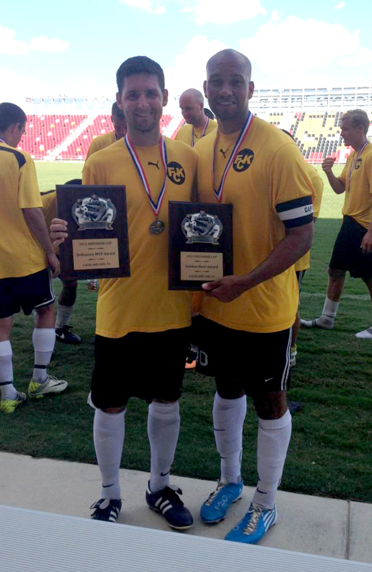 Members of the Kirtland soccer team pose with their awards following the 2013 Defender's Cup, the largest military soccer tournament in the United States.  Left, Capt. Jeremiah Kirschman, Air Force Research Laboratory, won the Defensive Player of the Tournament award, while Staff Sgt. Peter Miller (58th AMXS) won the Golden Boot Award for scoring most goals in the tournament.   (Courtesy photo)