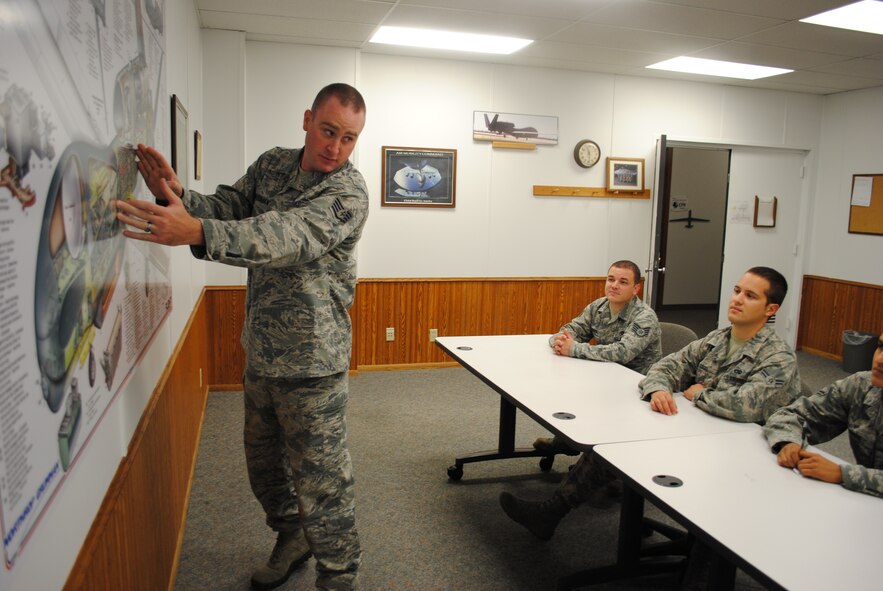 Staff Sgt. Kory Boardman from the 372nd Training Squadron, Detachment 27, shows student Airmen where a group of antennas are located on an RQ-4 Block 40 Global Hawk during a training session Sept. 9, 2013, on Grand Forks Air Force Base, N.D.  Boardman was selected as the base’s Warrior of the Week for the third week of September 2013. He serves as a unit safety representative and physical training leader in addition to his duties as a field training detachment instructor. (U.S. Air Force photo/Staff Sgt. Luis Loza Gutierrez) 