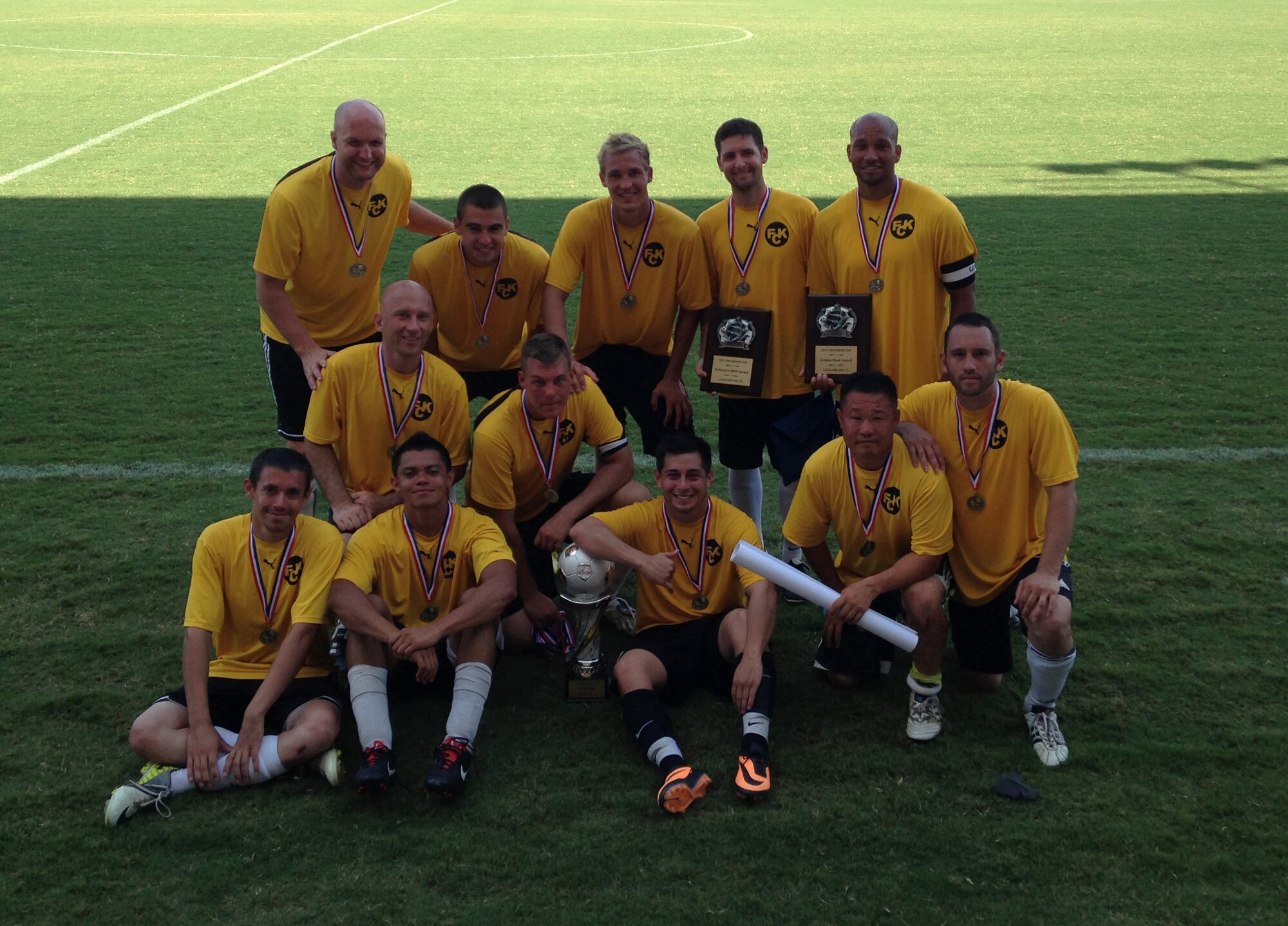 Members of the Kirtland soccer team pose around the trophy for winning the 2013 Defender's Cup, the largest military soccer tournament in the United States.  

Back row (left to right): Capt. Donald Bleeker (AFRL), Airman 1st Class John David (58th AMXS), 2nd Lt. Garrett Getschow (Air Force Academy), Capt. Jeremiah Kirschman (AFRL), Staff Sgt. Peter Miller (58th AMXS)

Middle row: Lt Jonathan Leverett (150 ANG), Staff Sgt Scott Elbers (58th MXS)

Front row: Airman 1st Class Brian Ott (58th AMXS), Airman 1st Class Doug Ramirez (58th AMXS), 2nd Lt. Benjamin Chavez (Air Force Academy), Tech. Sgt. James Swenson (58th MXS), Tech. Sgt. Jesus Aguayo (58th MXS)