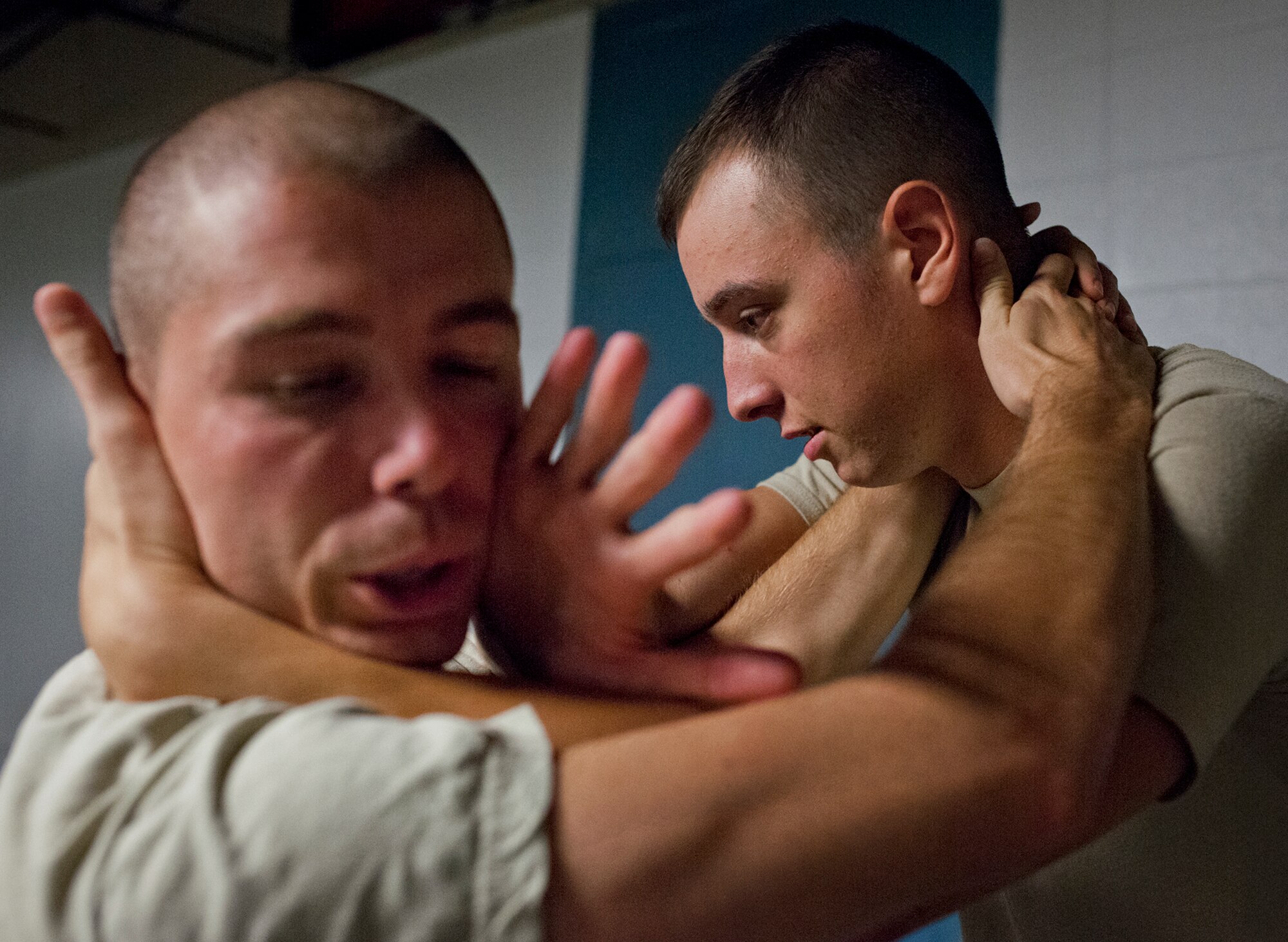 Hurlburt Field security forces Airmen work through the motions of a defensive technique during a day of training at the week-long combatives instructor course Sept. 12 at Eglin Air Force Base, Fla.  More than 25 Airmen from Eglin and Hurlburt Field completed the course earning their instructor certification.  The course was hosted by the 96th Ground Combat Training Squadron and taught by Staff Sgt. Christy Sturdivant.  (U.S. Air Force photo/Samuel King Jr.) 