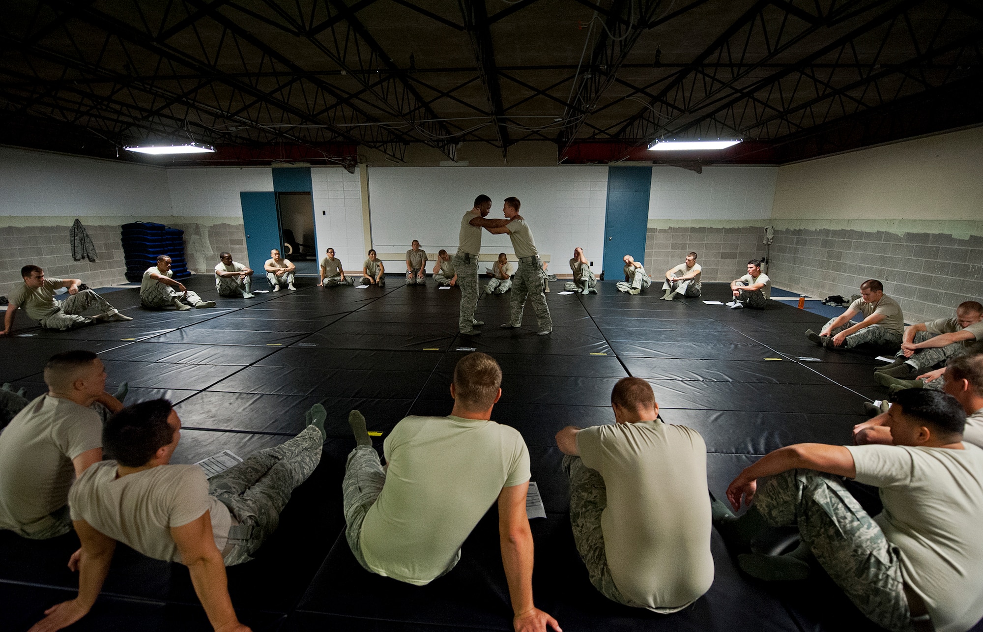 Security Forces Airmen demonstrate take-down techniques during a day of training at the week-long combatives instructor course Sept. 12 at Eglin Air Force Base, Fla.  More than 25 Airmen from Eglin and Hurlburt Field completed the course earning their instructor certification.  The course was hosted by the 96th Ground Combat Training Squadron and taught by Staff Sgt. Christy Sturdivant.  (U.S. Air Force photo/Samuel King Jr.)