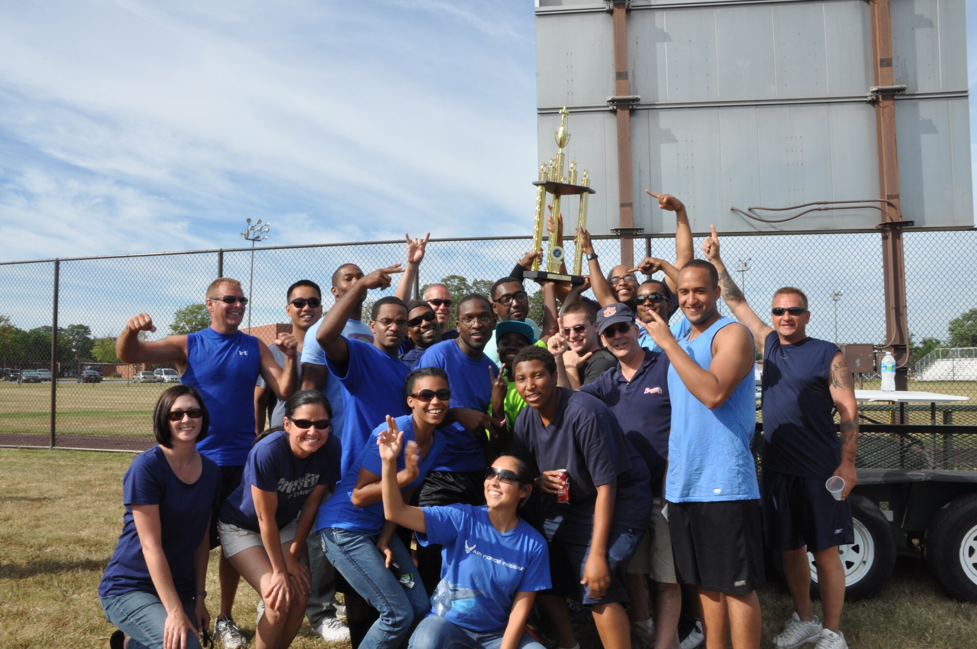 Members from the 459th Maintenance Group pose for a picture after being declared winners of the sports and family day at Joint Base Andrews, Md., September 15, 2013. This is the second year in a row the trophy went to MXG. (U.S. Air Force photo/ Staff Sgt. Katie Spencer) 