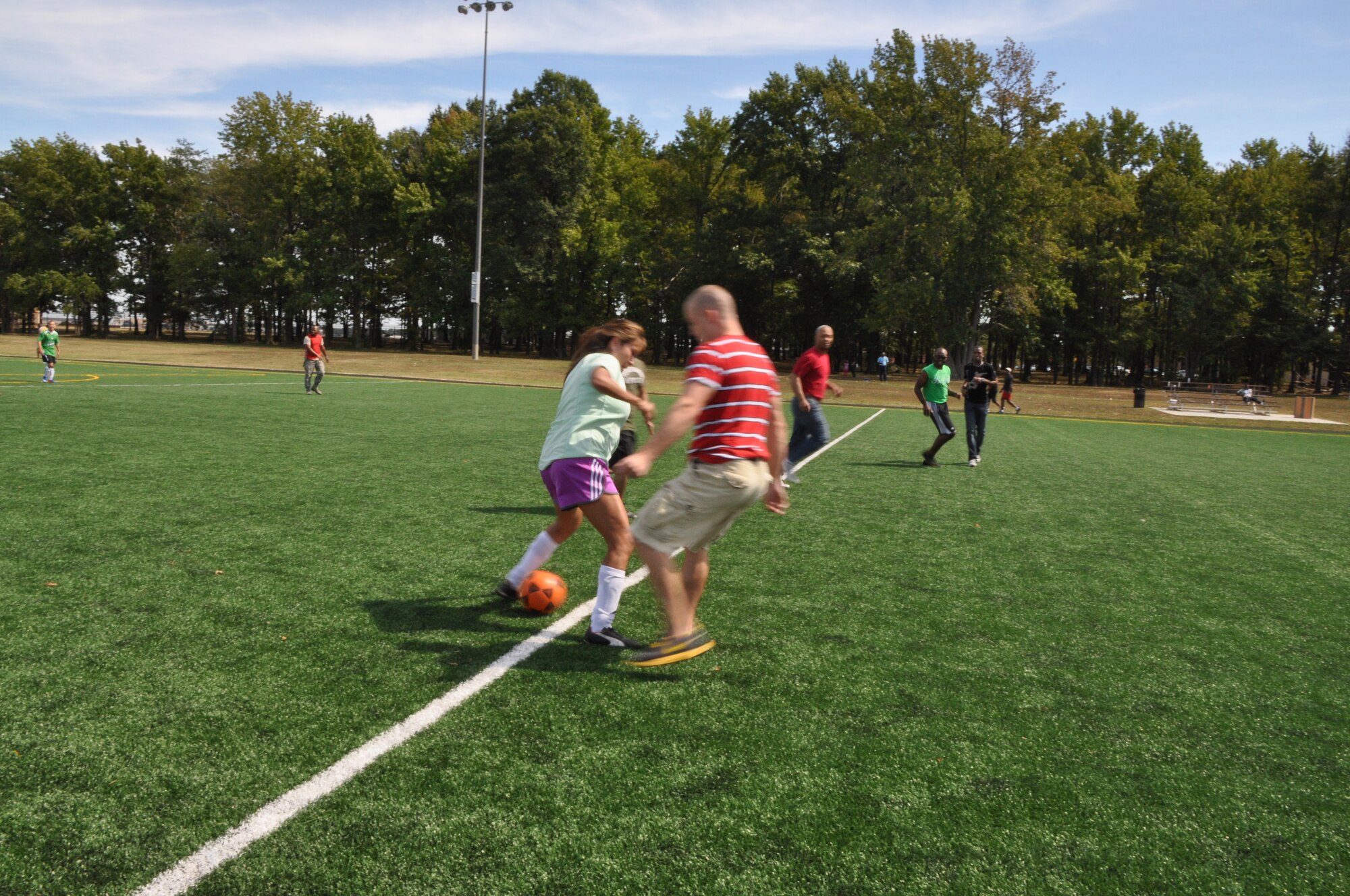 Members from the 459th Air Refueling Wing play soccer during the wing’s sports and family day at Joint Base Andrews, Md., September 15, 2013. Soccer was one of the many sports at the wing’s family day event. (U.S. Air Force photo/ Staff Sgt. Katie Spencer) 