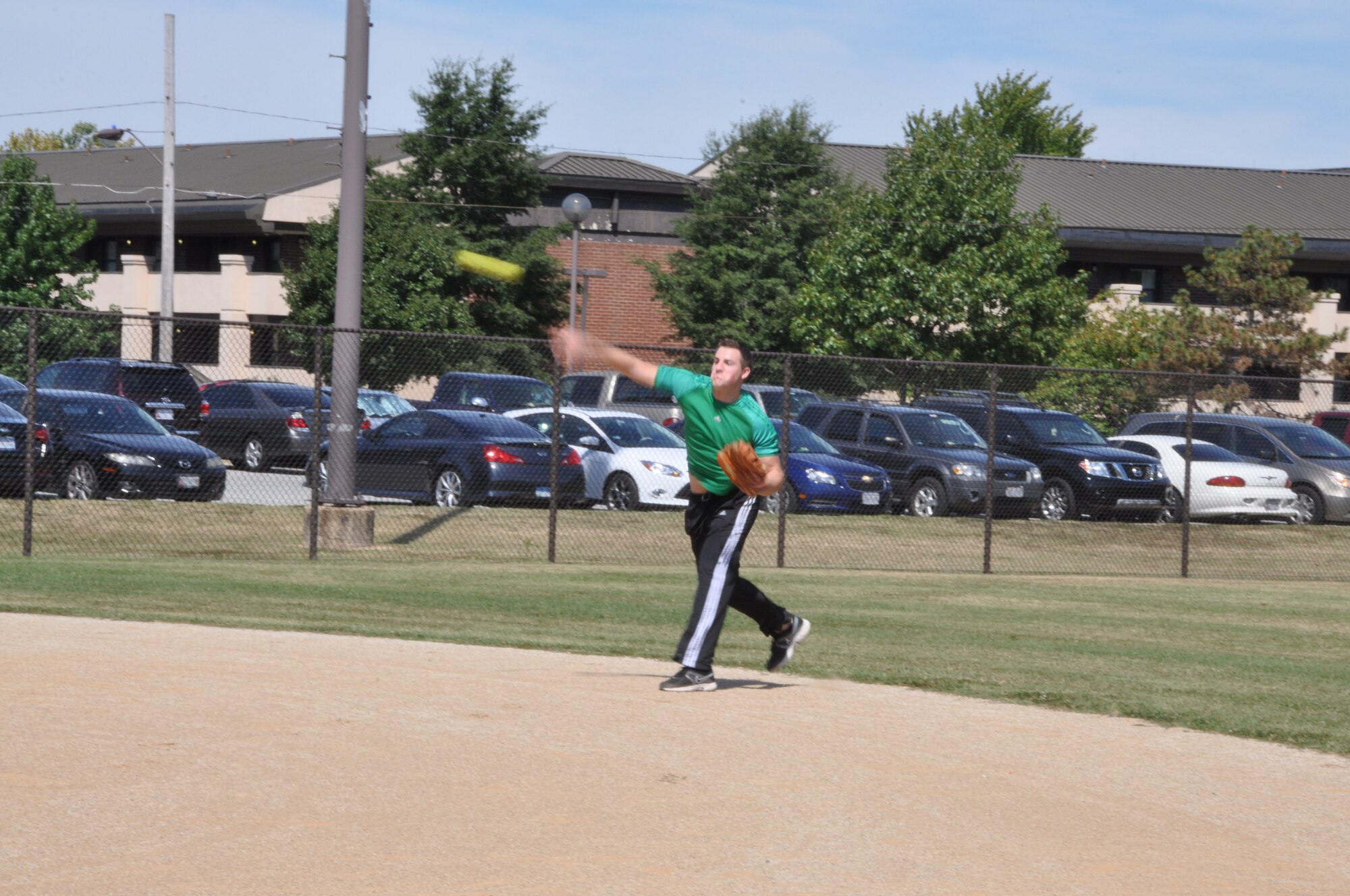 U.S. Air Force Senior Airman Josh Jackson, 69th Aerial Port Squadron, throws a softball back to the pitcher during a softball game at the wings sports and family day at Joint Base Andrews, Md., September 15, 2013. Softball was one of the many sports at the wing’s family day event. (U.S. Air Force photo/ Staff Sgt. Katie Spencer)