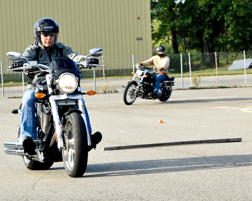 U.S. Army Maj. Scott Benson, a student in the Experienced Riders Motorcycle Course, rides around the training course before starting a series of maneuvers at Fort Eustis, Va., Sept. 17, 2013. The all-day course puts riders through a variety of exercises and scenarios that allow them to be better riders in the future. (U.S. Air Force photo by Staff Sgt. Wesley Farnsworth/Released)