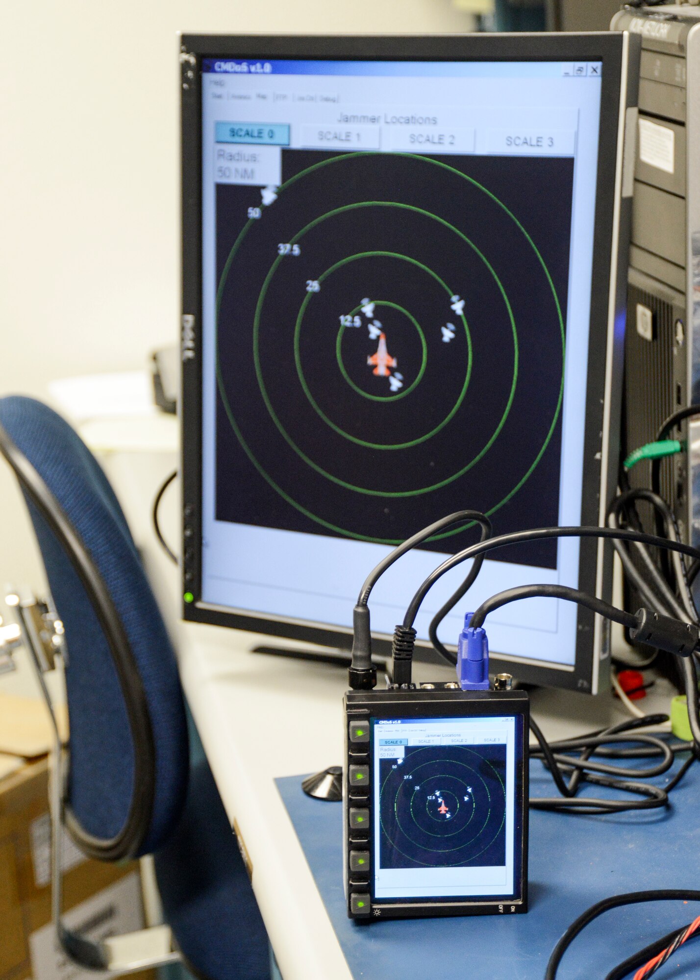 The Control Monitoring and Debugging system which was developed jointly with the Air Force Institute of Technology and the Air Force Research Laboratory is designed to operate using a simple five-button control system. (U.S. Air Force photo by Rebecca Amber) 